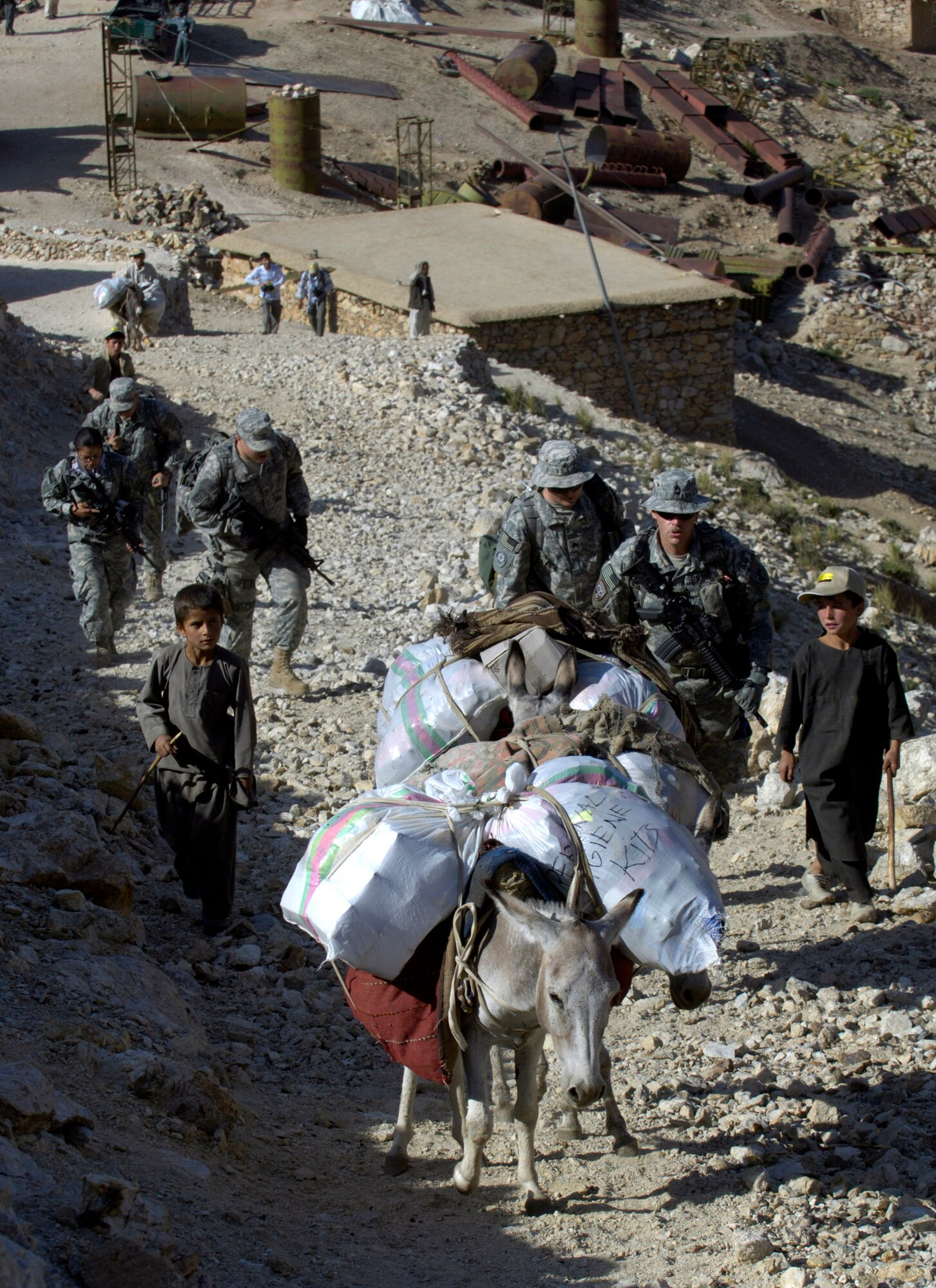 Donkeys loaded with medical supplies and humanitarian aid accompany members of the Panjshir Provincial Reconstruction Team Aug. 7 in Afghanistan. The PRT members made an 11-mile round-trip trek over a mountain pass and into a river valley to provide medical care to Afghans living in the Roydara village in the Shutol district of Panjshir province of Afghanistan. The Panjshir PRT stood up in 2005 and is directed by Ben Lowenthal from the U.S. State Department. Housed at Forward Operating Base Lion in the Hindu Kush mountains, the 40-member team interfaces with a population of approximately 300,000 Afghans spread across 1,393 square miles in six provinces. (U.S. Air Force photo/Master Sgt. Jim Varhegyi)
