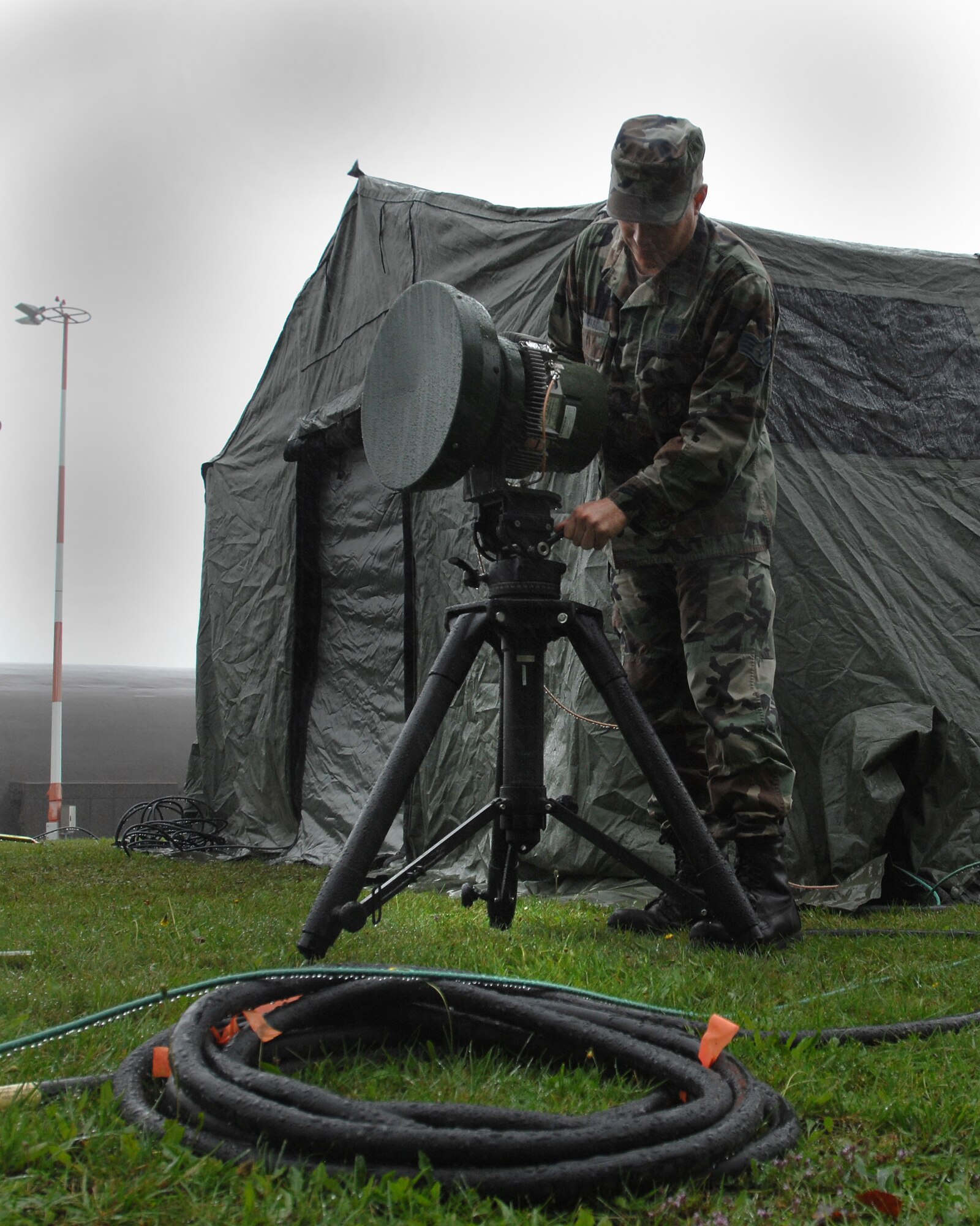 1st Combat Communications Squadron tech control technician Staff Sgt. Les Jimerson provides direction to his Airmen to extend wireless voice and data services to the command operations tent on Camp Fasnacht during exercise Healthy Star Aug. 9, 2007 at Ramstein Air Base, Germany. Healthy Star is a field training exercise to prepare combat communications Airmen for deployed situations. (U.S. Air Force photo/Airman 1st Class Kenny Holston)