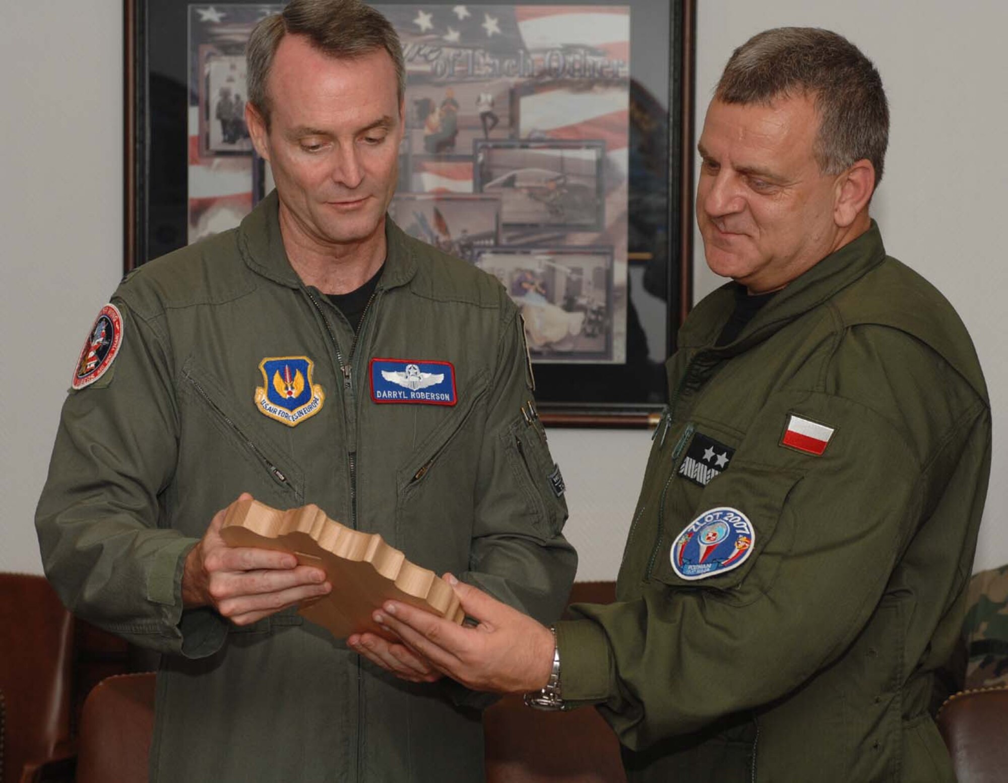 SPANGDAHLEM AIR BASE, Germany – Col. Darryl Roberson, 52nd Fighter Wing commander, presents Maj. Gen. Andrzej Blasik, Polish air force commander, with a plaque as memento. Members of the Polish air force spent two days visiting Spangdahlem to learn about the base operations and support activities. (U.S. Air Force photo/Airman 1st Class Stephanie Clark)