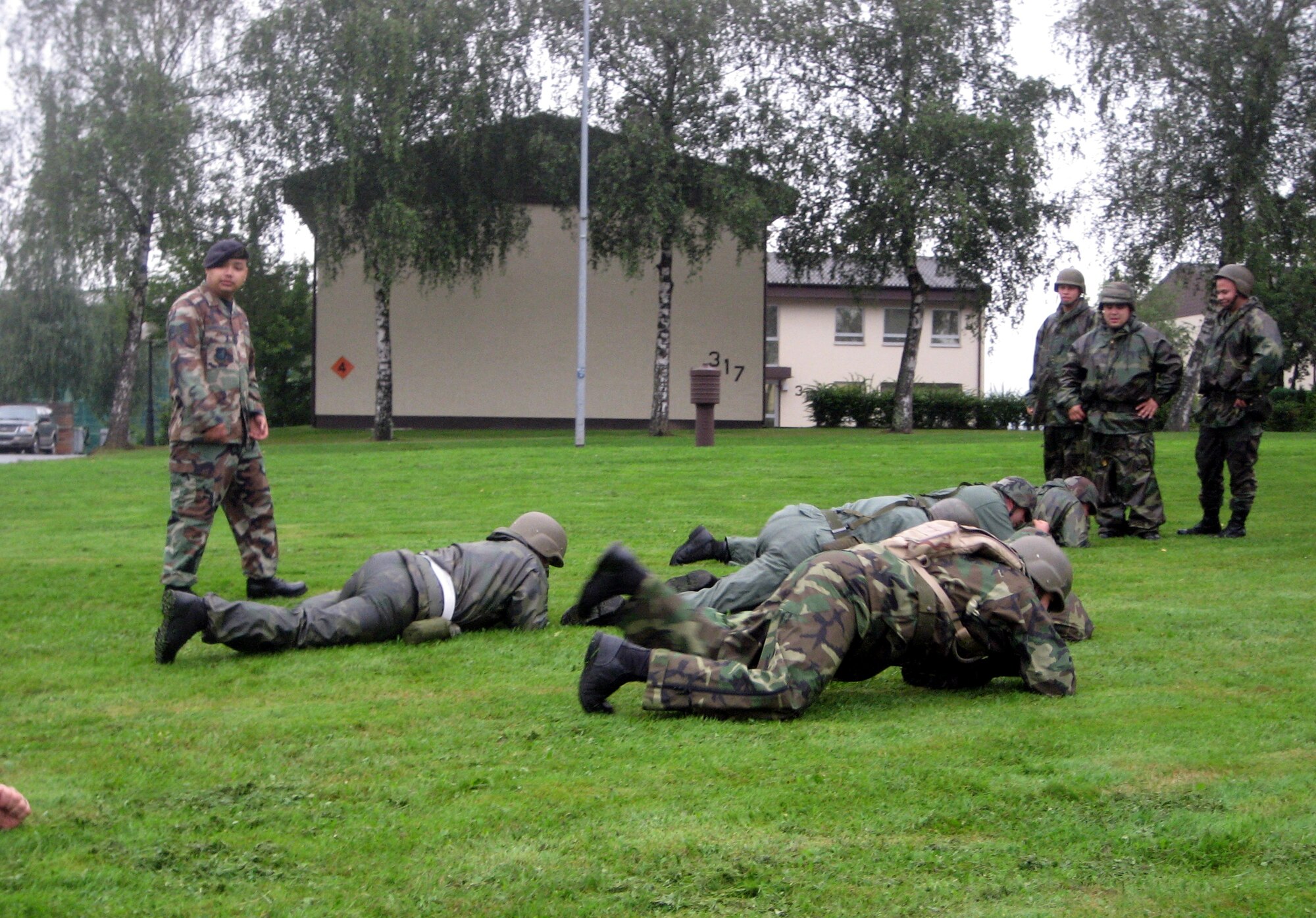 SPANGDAHLEM AIR BASE, Germany – Senior Airman Rickie Chargualaf, 52nd Security Forces Squadron training instructor, runs through low crawl and high crawl drills during an Expeditionary Combat Skills class Aug. 10. (U.S. Air Force photo/Staff Sgt. Andrea Knudson) 