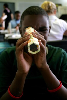 Frazier Pollard, son of Tech. Sgt. Angela Banks, 18th Mission Support Squadron, checks out his "mangekyoo" — a kaleidoscope decorated with Japanese paper called "washi" — during washi class Aug. 8 at the Airman and Family Readiness Center. The two-hour washi class was the third in a series of free cultural classes designed to expose teens to various elements of Japanese culture. The cultural class series was an activity idea resulting from the teen town hall meeting in June.
(U.S. Air Force photo/Senior Airman Nestor Cruz)
