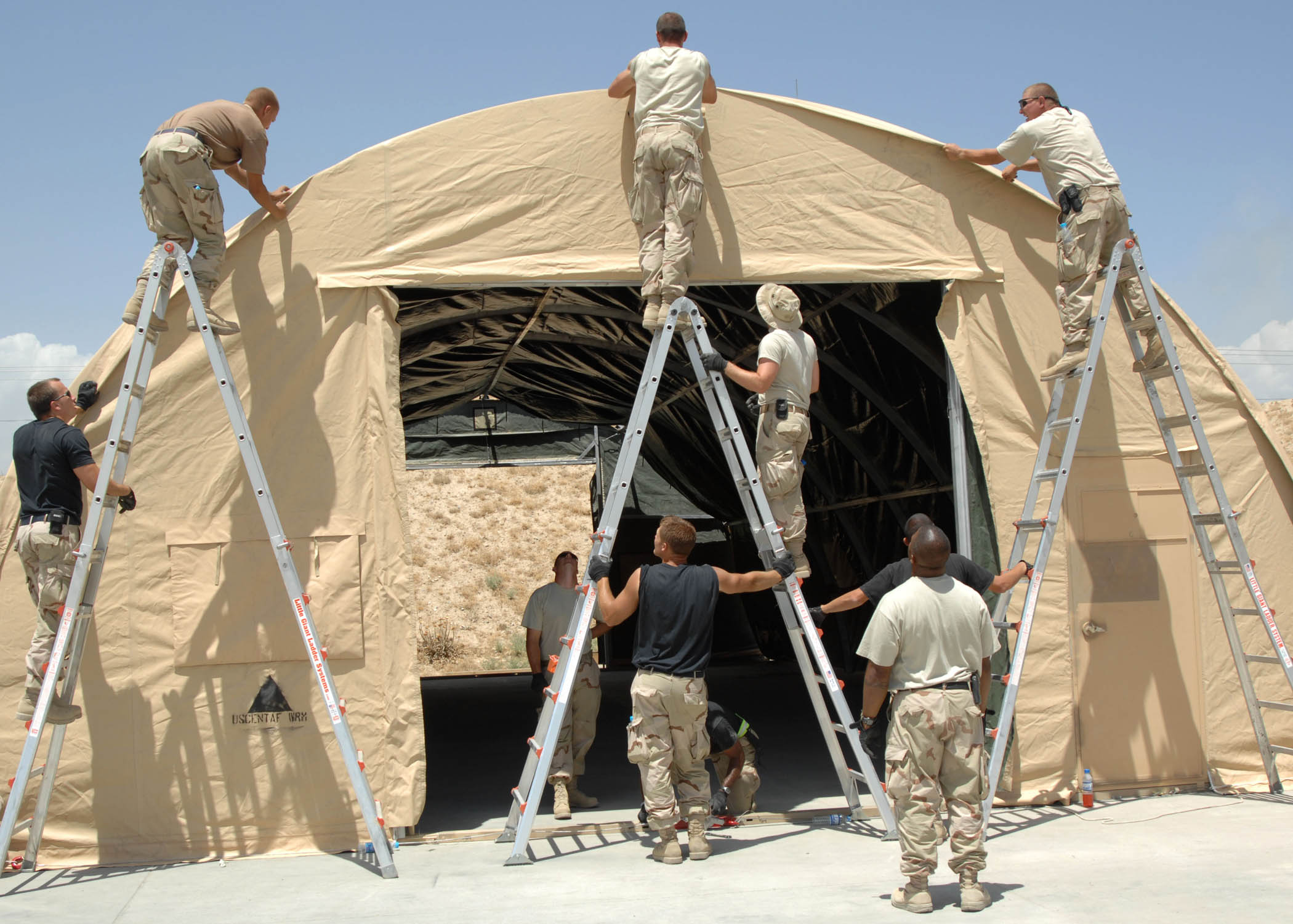 Civil Engineers, Maintainers work together to build tent > U.S. Air