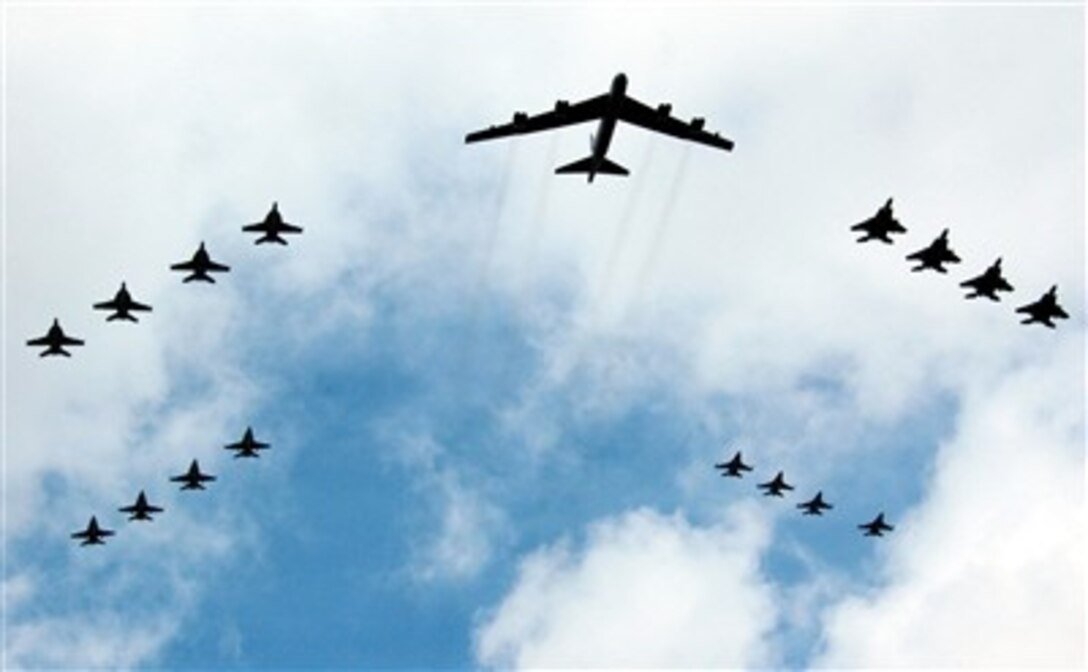 A U.S. Air Force B-52  and 16 other Air Force and Navy aircraft fly over USS Kitty Hawk on Aug. 14, 2007, during Valiant Shield 2007, the largest joint exercise in the Pacific this year. Held in the Guam operating area, the exercise includes 30 ships, more than 280 aircraft and more than 20,000 servicemembers from the Navy, Air force, Marine Corps, and Coast Guard.  
