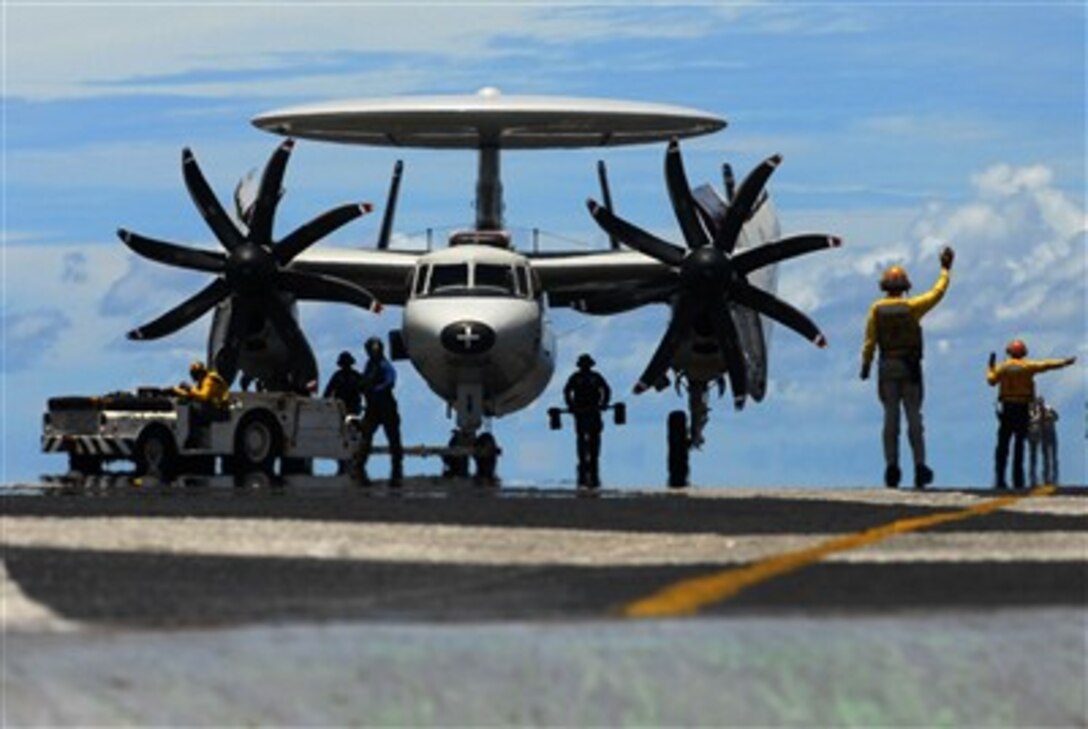 U.S. Navy flight deck personnel direct an E-2C Hawkeye aircraft to the catapult for launch from the flight deck of the aircraft carrier USS John C. Stennis (CVN 74) during Exercise Valiant Shield 2007 flight operations in the Pacific Ocean on Aug.13, 2007.  The joint exercise is being held in the Guam operating area and involves 30 naval vessels, more than 280 aircraft, and approximately 20,000 service members from the Navy, Army, Air Force, Marine Corps and Coast Guard. 