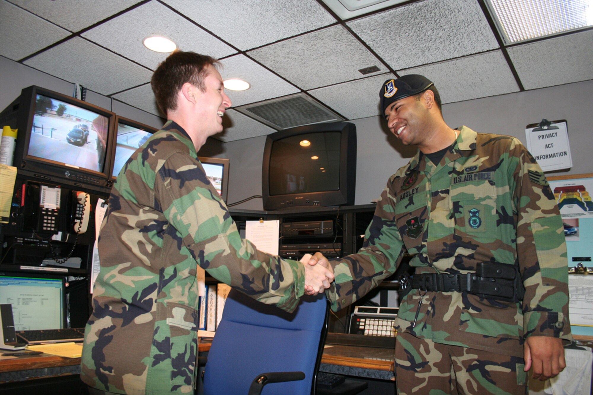 2nd Lt. Jeremy Caudill, chaplain candidate, provides Vance Chapel information to Senior Airman Shawn Ausley, 71st Security Forces Squadron.  Lieutenant Caudill completes the Air Force Chaplain Candidate Program in January.  (U.S. Air Force photo by Chaplain (Capt.) Zachary Nash)