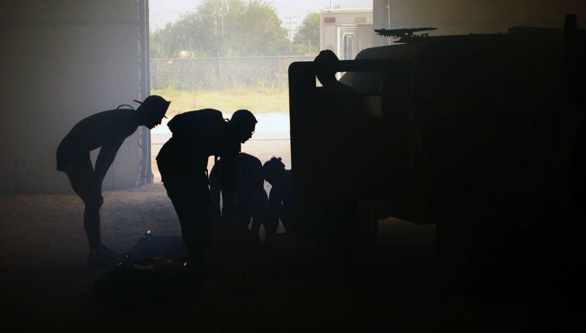 Students of the Expeditionary Medical Support course at Brooks City-Base, Texas, work on a "patient" Aug. 8 during the exercise portion of the class.  Instructors at the course ensure that the training is as realistic as possible.  (U.S. Air Force Photo/Staff Sgt. Jeremy Larlee) 