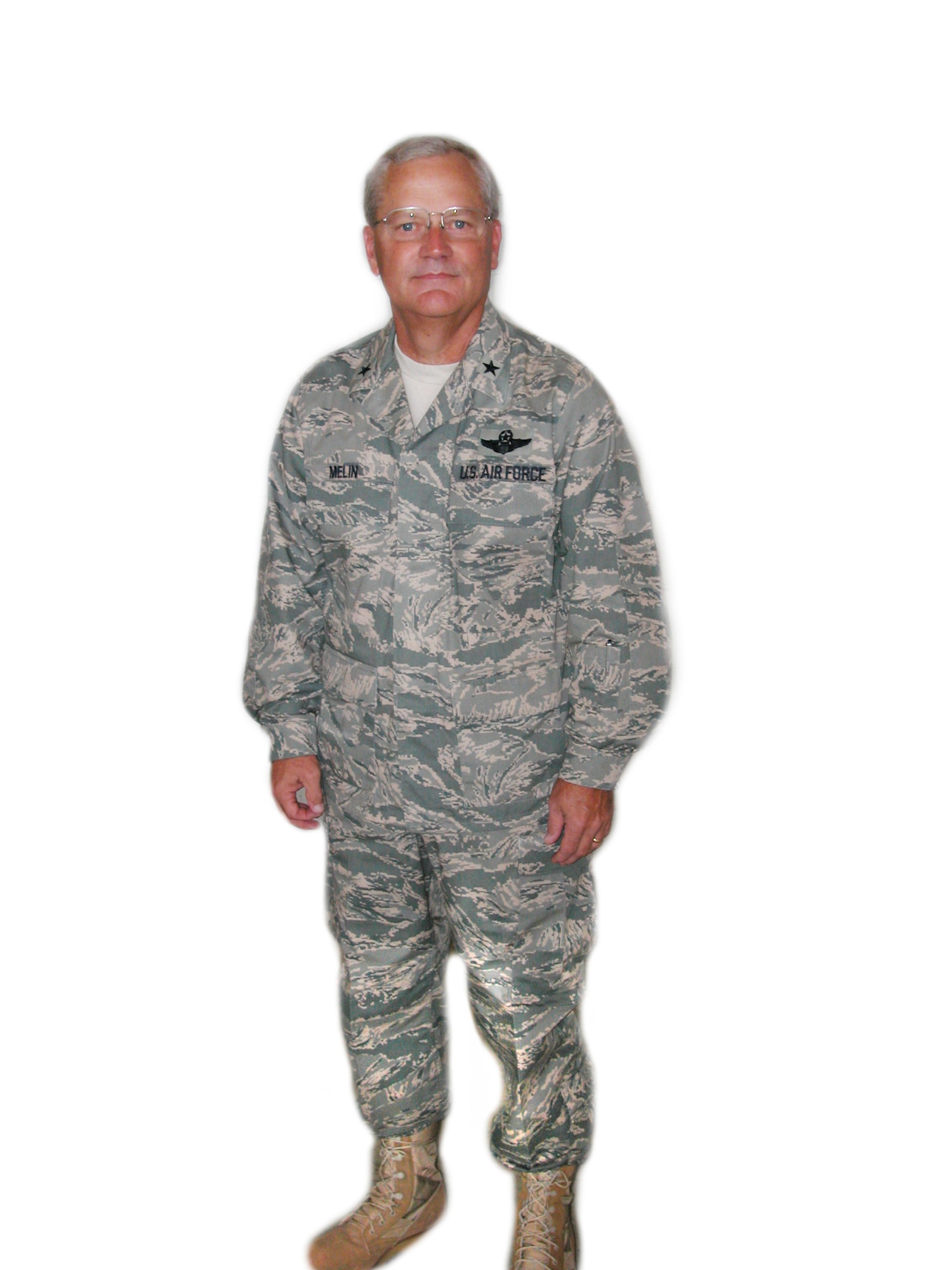 Brig. Gen. James Melin, the 452nd Air Mobility Wing commander at March Air Reserve Base, shows his new Airman Battle Uniform to troops during the A Unit Training Assembly Aug. 12. According to the general, troops at March should expect to get their uniforms issued around spring time of 2008. He also noted that though uniforms will be available for purchase starting in October, enlisted members who choose to purchase them before the actual issue will not be reinbursed.            
