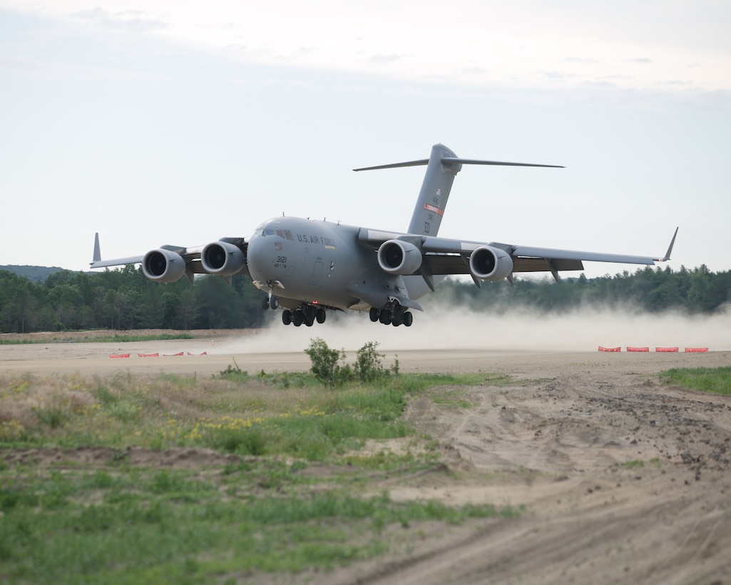 A C-17 Globemaster III performs a semi-prepared runway operations test at Fort McCoy, Wis., on June 22. The 418th Flight Test Squadron here performed the testing from June 15 to Aug. 1. The Wisconsin sortie was the third phase of the testing. The C-17 is scheduled to go to Fort Chaffee, Ark., for the fourth phase, which is scheduled to be completed by November. (Photo by Jet Fabara)