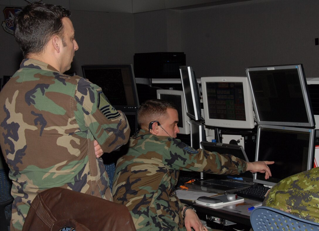 Members from the Northeast Air Defense Sector perform their command and control mission in order to prevent air attacks against the U.S. by responding to unknown, unwanted and unauthorized air activity approaching and operating within U.S. sovereign airspace.  (U.S. Air Force Photo/174th Fighter Wing Visual Information)