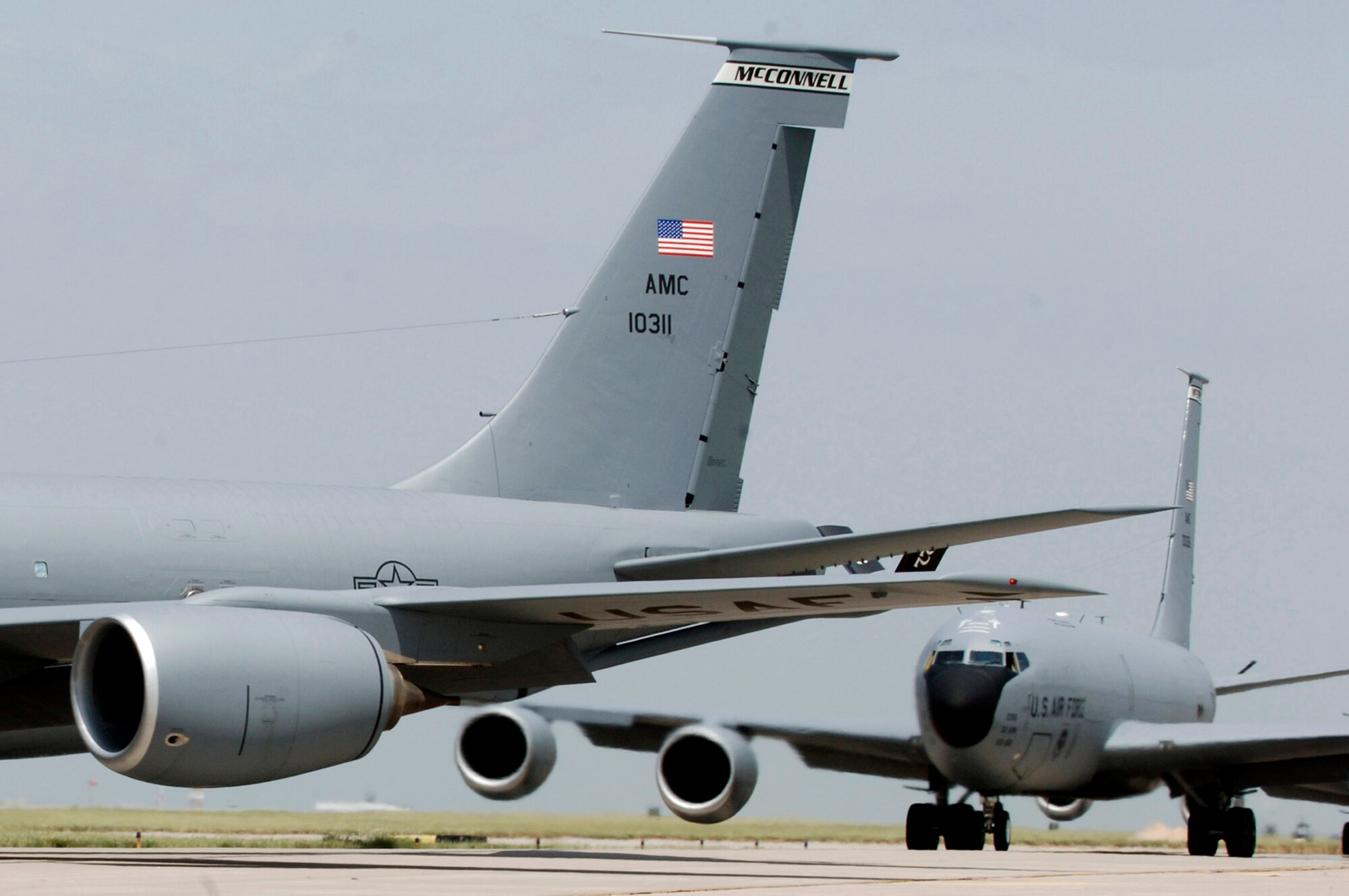 KC-135 Stratotankers turn onto a taxiway to form the elephant walk formation right behind each during a generation exercise Aug. 5 at McConnell Air Force Base, Kan. The exercise showcased the base aircrews' capability to prepare a flight and take off within minutes of being notified of a mission. (U.S. Air Force photo/Airman Justin Shelton)
