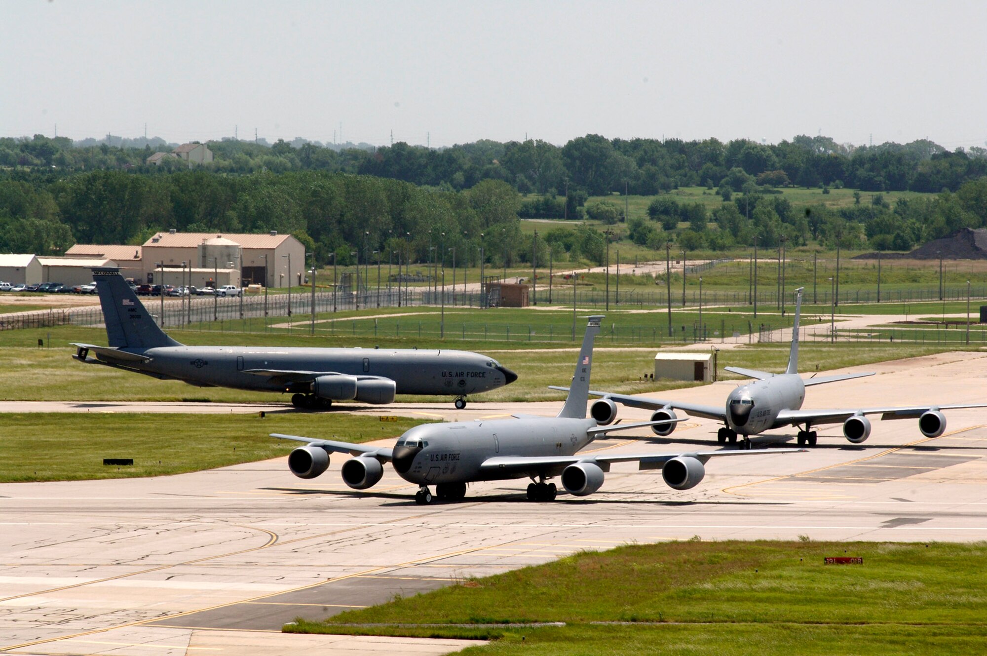 KC-135 Stratotankers turn onto a taxiway to form the elephant walk formation during a generation exercise Aug. 5 at McConnell Air Force Base, Kan. The exercise showcased McConnell AFB aircrews' capability to prepare a flight and take off within minutes of being notified of a mission. (U.S. Air Force photo/Tech. Sgt. Chyrece Campbell)
