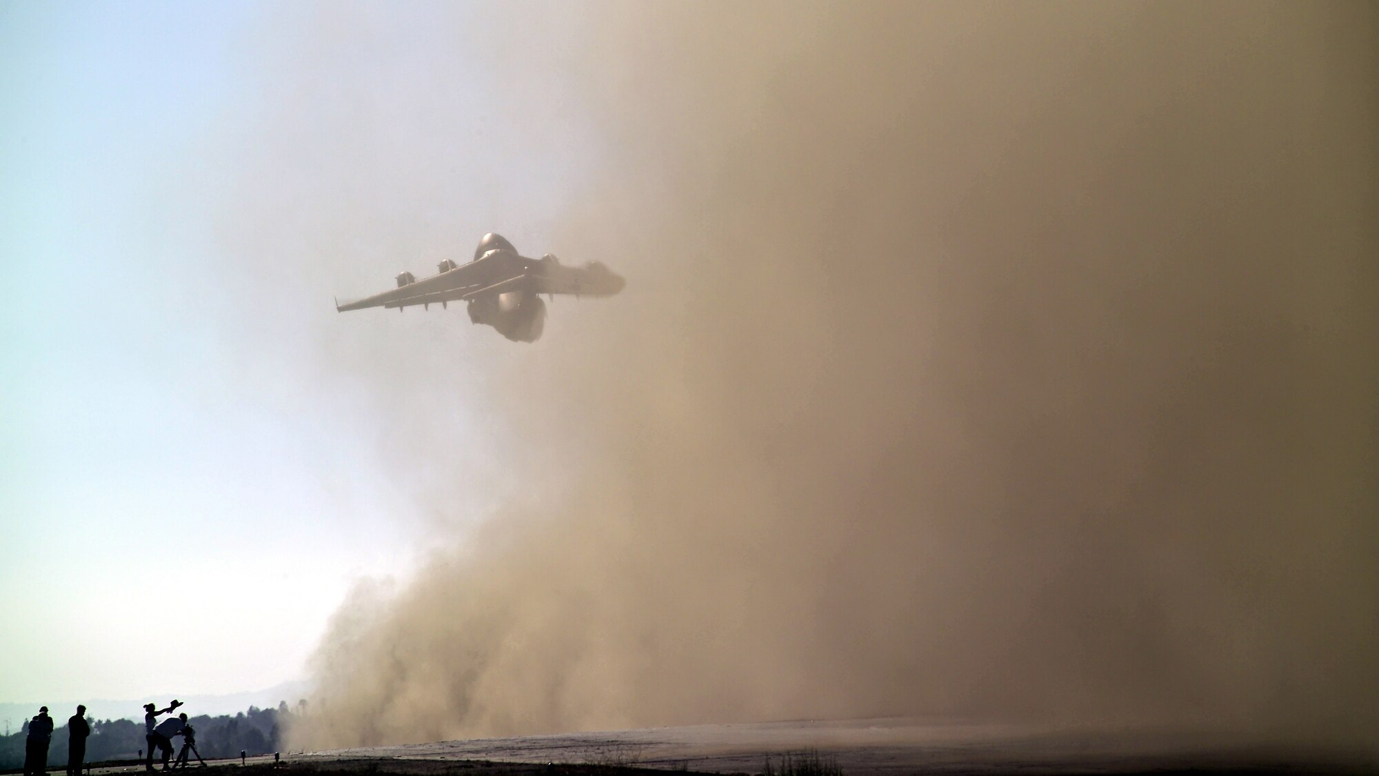 As cameras roll, a C-17 assigned to the 452nd Air Mobility Wing from March Air Reserve Base, Calif., roars into the morning sky.  The aircraft and its crew of Reservists were filming a public service announcement recently for the Air Force Reserve called ?America?s Wingman.? To simulate the conditions needed for the filming, the C-17 took off and landed at Riverside Airport, Riverside, Calif.  About 50 people, including many avid photographers, watched the event.  The PSA should start airing later this year. (Courtesy Photo/Sterling Martell)