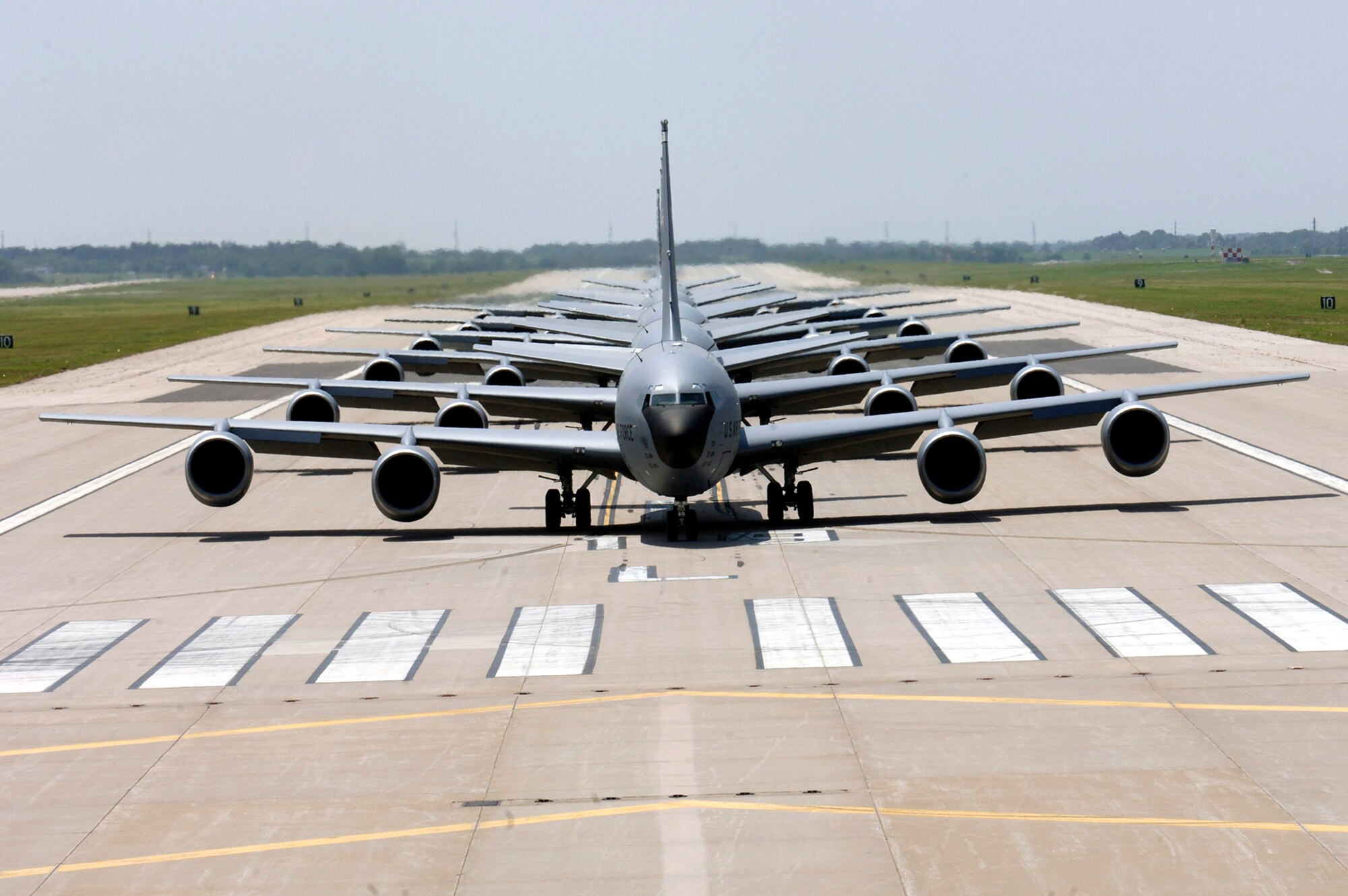 Six KC-135 Stratotankers demonstrate the elephant walk formation as they taxi down a runway right behind each other during a generation exercise Aug. 5 at McConnell Air Force Base, Kan. The exercise showcased McConnell AFB aircrews' capability to prepare a flight and take off within minutes of being notified of a mission. (U.S. Air Force photo/Airman 1st Class Laura Suttles)
