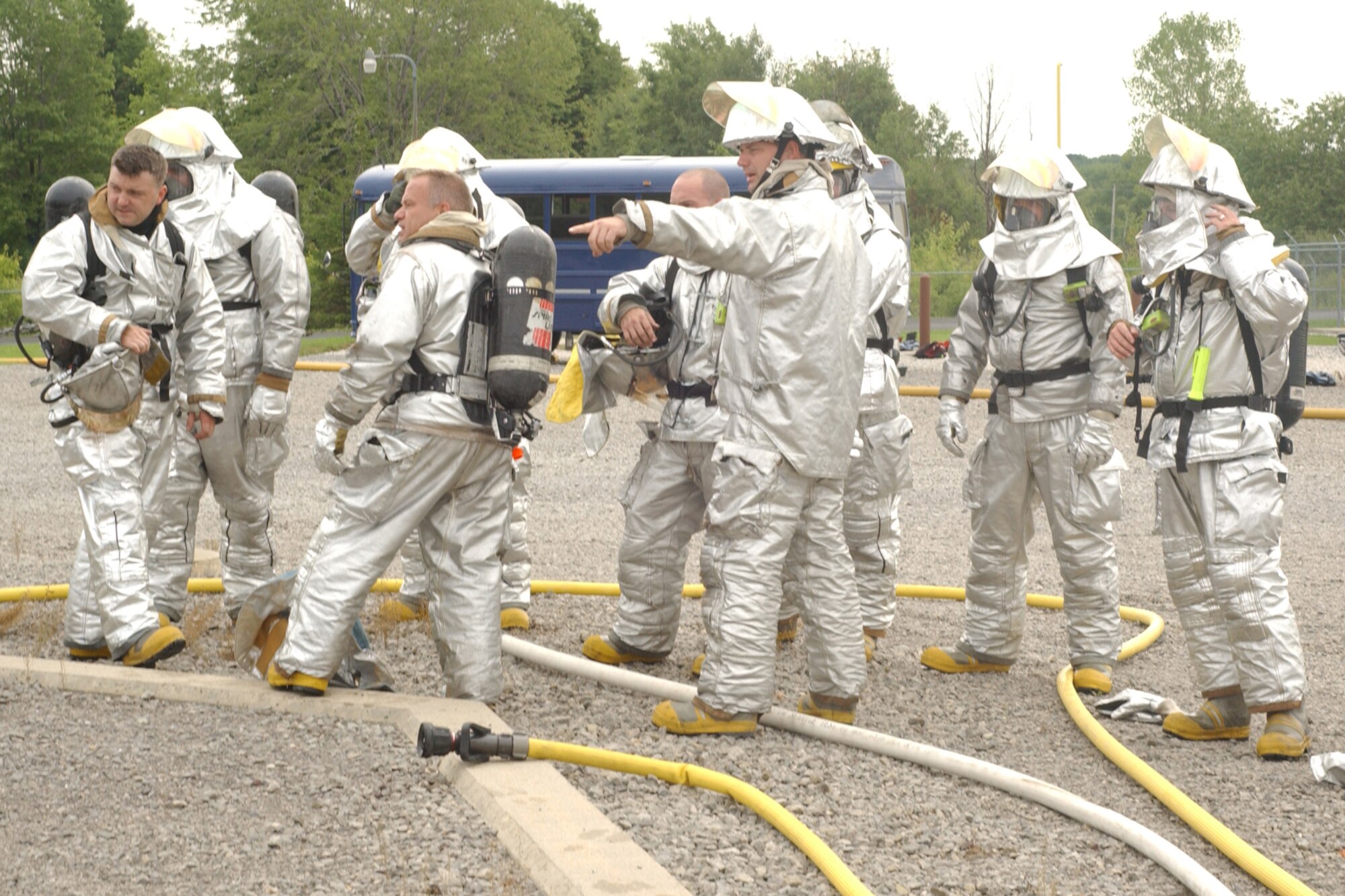 YOUNGSTOWN AIR RESERVE STATION, Ohio -- 910th Airlift Wing firefighters team up with Air National Guard firefighters from the 179th Airlift Wing, Mansfield Air National Guard Base, Ohio, Aug. 14, to fight a simulated aircraft fire at the base fire training facility here.  The training was to coincide with the Guard unit's annual FAA training requirements.  (U.S. Air Force photo/SrA. Clint Kline)                               