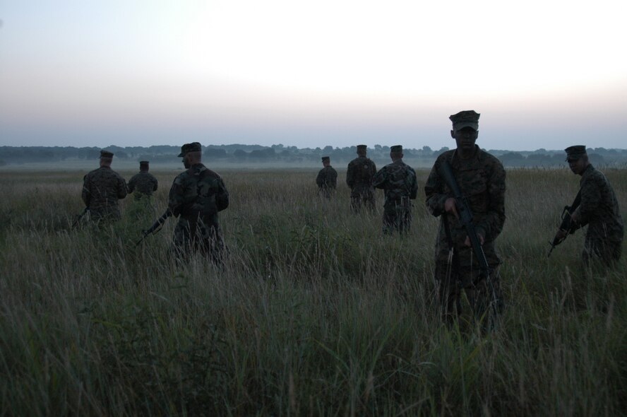 Marines and Airmen guard the camp during field training at Camp Bowie, Texas, early in the morning Aug. 5. (U.S. Air Force photo by Senior Airman Carolyn Viss)