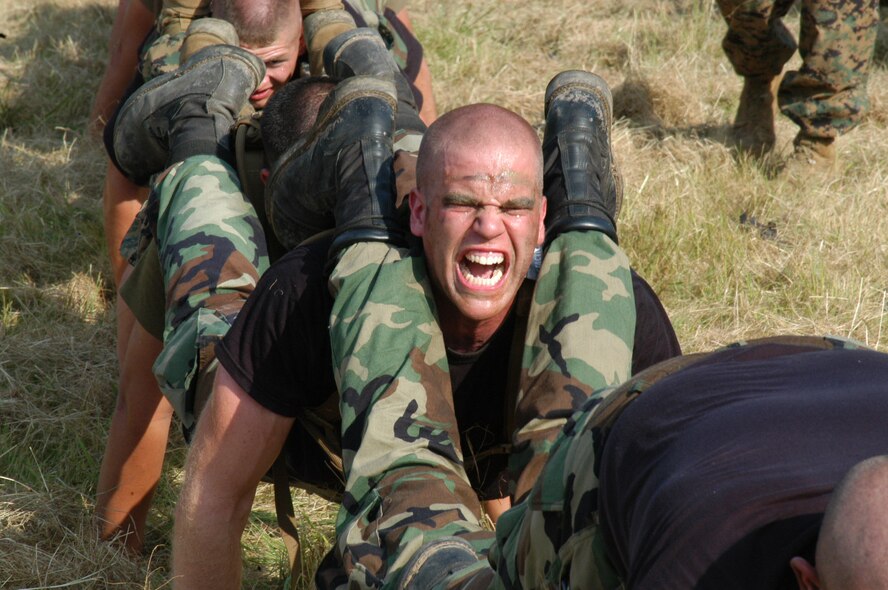 Physical training gets a little strenuous for Airman 1st Class John Ring, 317th Maintenance Squadron, during Marine Corps field training at Camp Bowie, Texas, Aug. 4 (U.S. Air Force photo by Senior Airman Carolyn Viss)