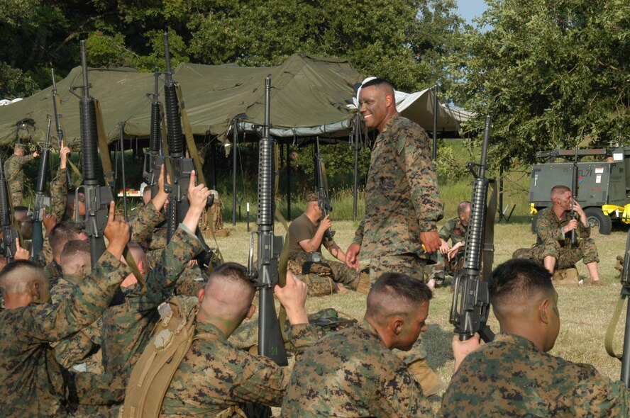 Marine 1st Sgt. Alfred Sly, Det-1 MTMC, performs a weapons count during field training evolution at Camp Bowie, Texas., Aug. 3. The Reserve detachment here invited Airmen to come along on the training, providing joint-ops experience for Marines and Airmen. (U.S. Air Force photo by Senior Airman Carolyn Viss) 