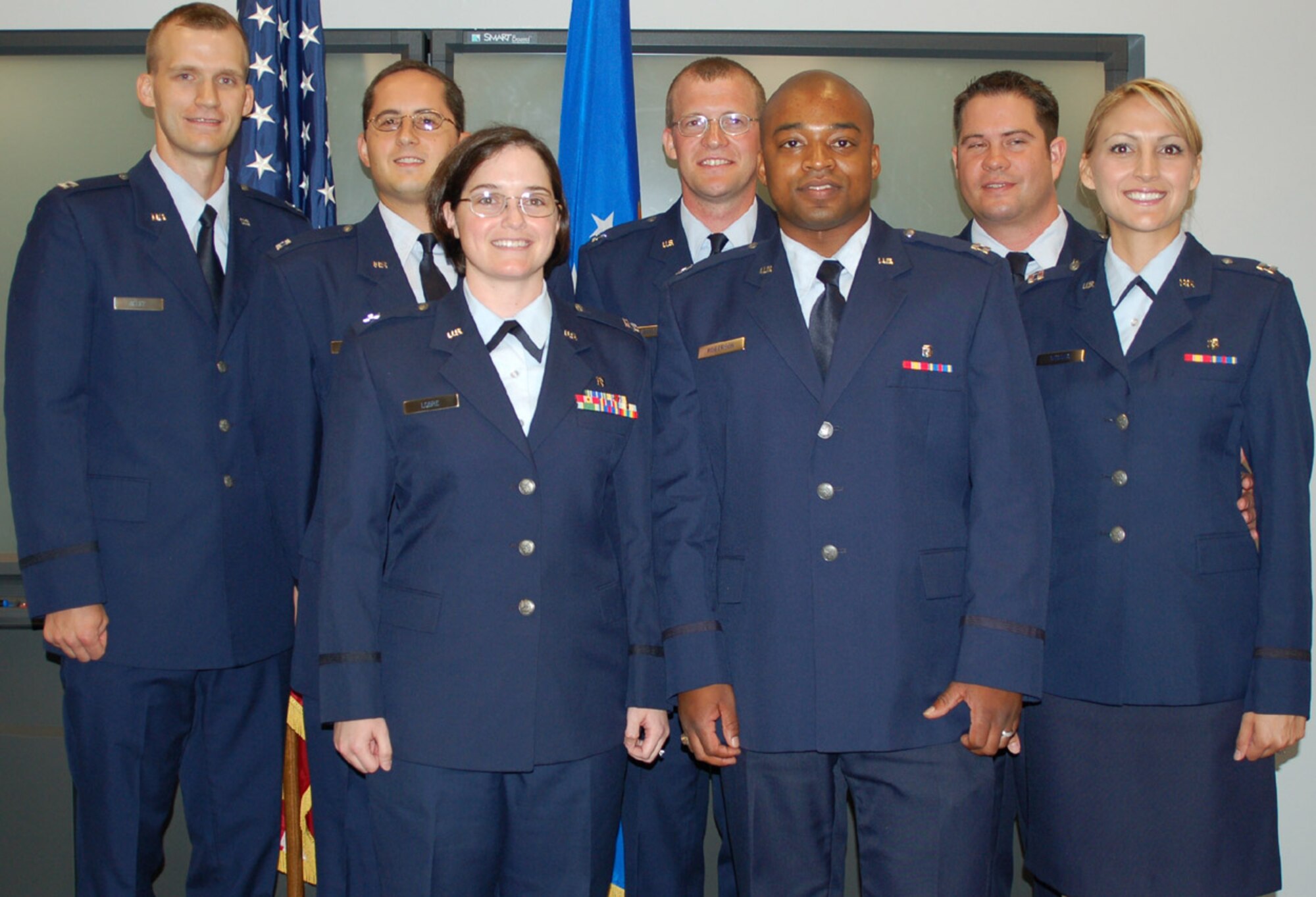 Dental residency graduates, from left, Captains Alley, DiFelice, Lobre, Richardson, Roberson, Rhodes and Rhodes-Sisson.  (U.S. Air Force photo by Steve Pivnick)