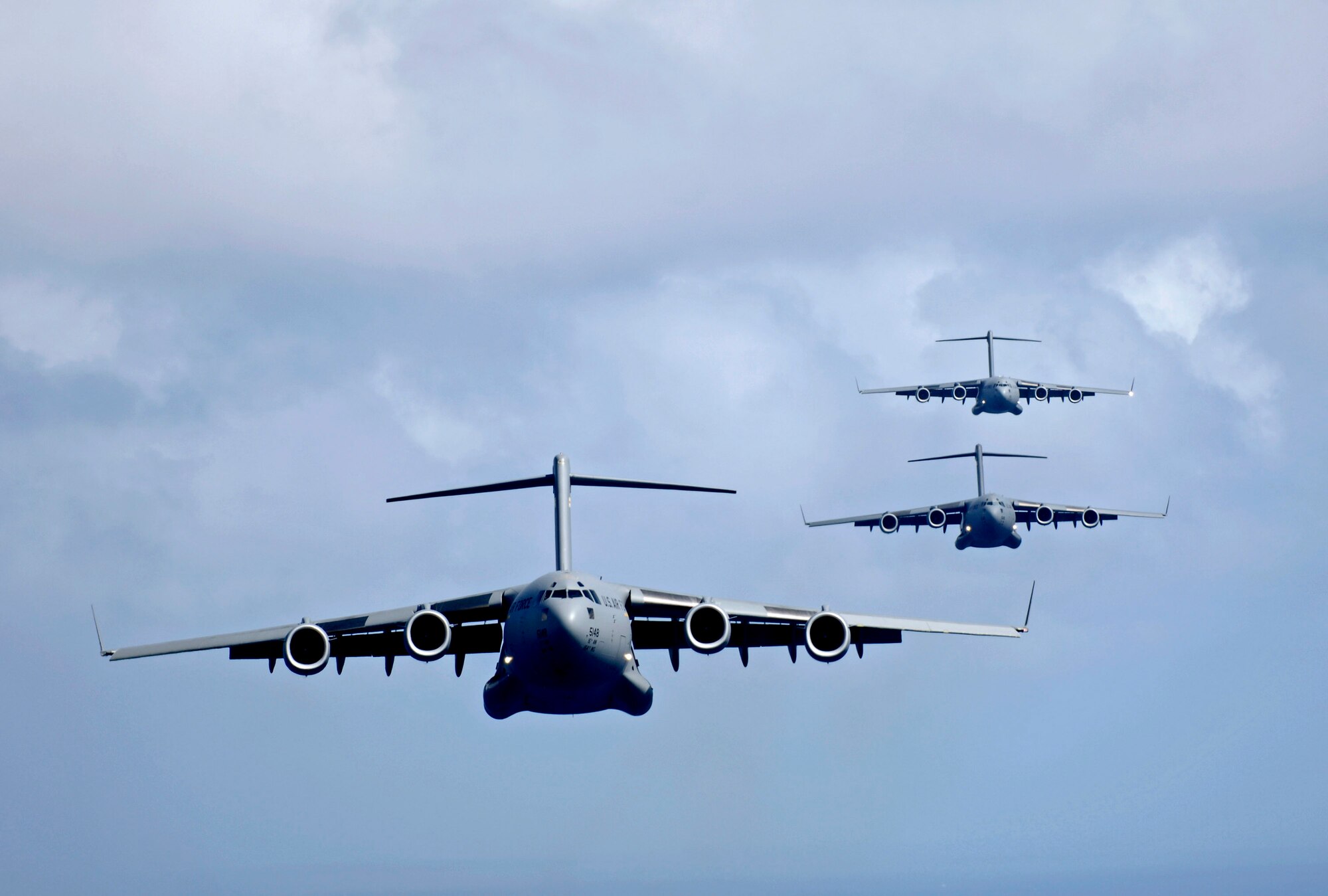 C-17 Globemaster IIIs participate in a four-ship, airdrop training mission Aug. 13 over the island of Oahu, Hawaii. The C-17s are assigned to the from the 535th Airlift Squadron from Hickam Air Force Base, Hawaii. The 535th AS aircrews conducted the multi-element training to maintain currency and proficiency. (U.S. Air Force photo/Tech. Sgt. Shane A. Cuomo) 