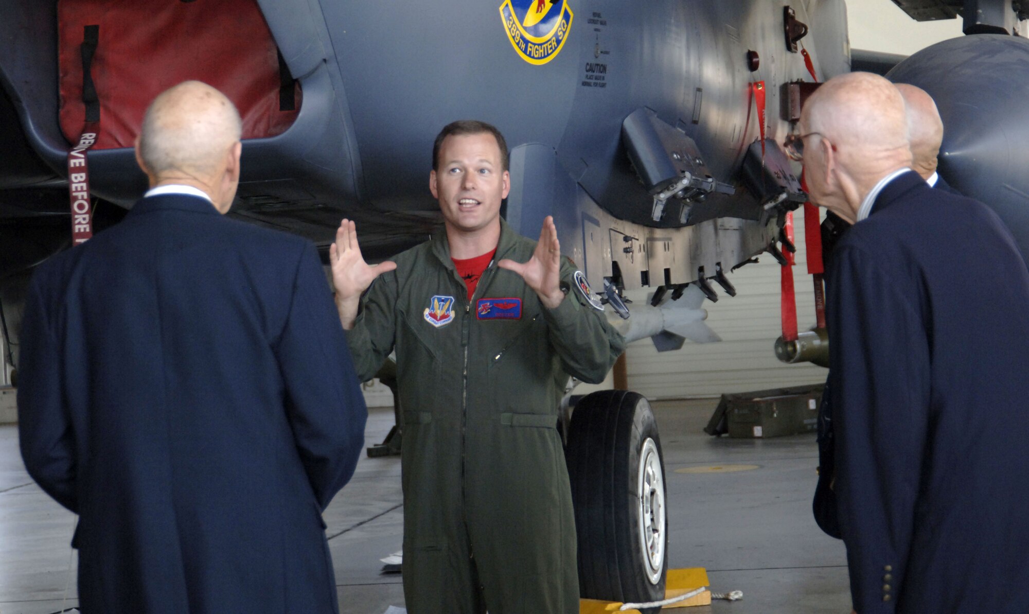 MOUNTAIN HOME AIR FORCE BASE, Idaho -- Maj. Grant "Doctor" Buck, 389th Fighter Squadron pilot, talks with three of the 13 remaining Doolittle Raiders. More than 65 years after flying 16 bombers over Japan to conduct the first bombing mission of World War II, retired Lt. Col. Richard E. Cole, retired Maj. Thomas C. Griffin and former Sgt. Dave Thatcher and their relatives visited the Gunfighters to tour the base Aug. 10. (U.S. Air Force photo/Staff Sgt. Jasmine Reif)