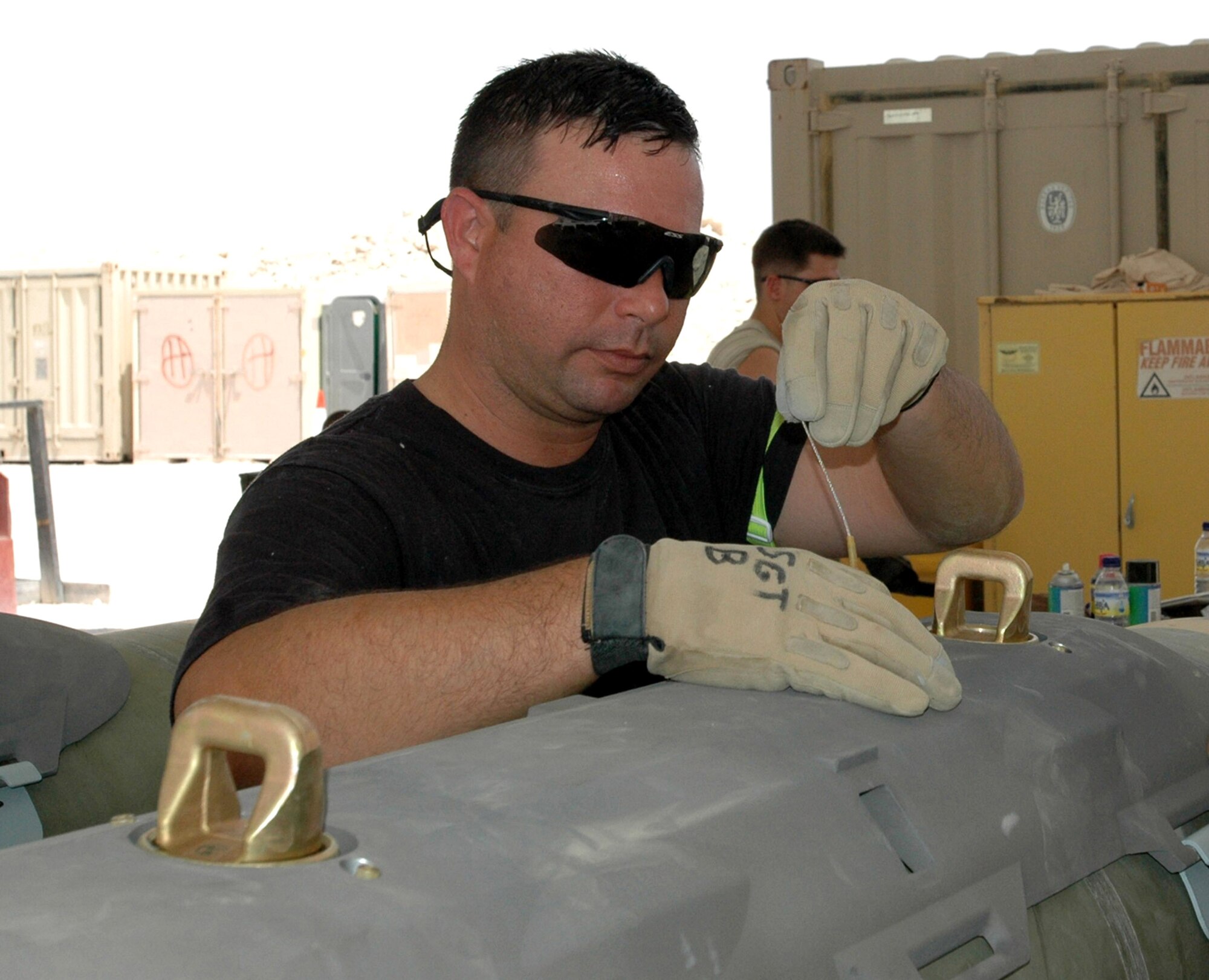 Staff Sgt. Donald Buono fuzes a guided bomb unit-31. Sergeant Buono is with the 379th Expeditionary Maintenance Squadron's ammo flight at a deployed location in Southwest Asia.  (U.S. Air Force photo/Capt. Teresa Sullivan) 