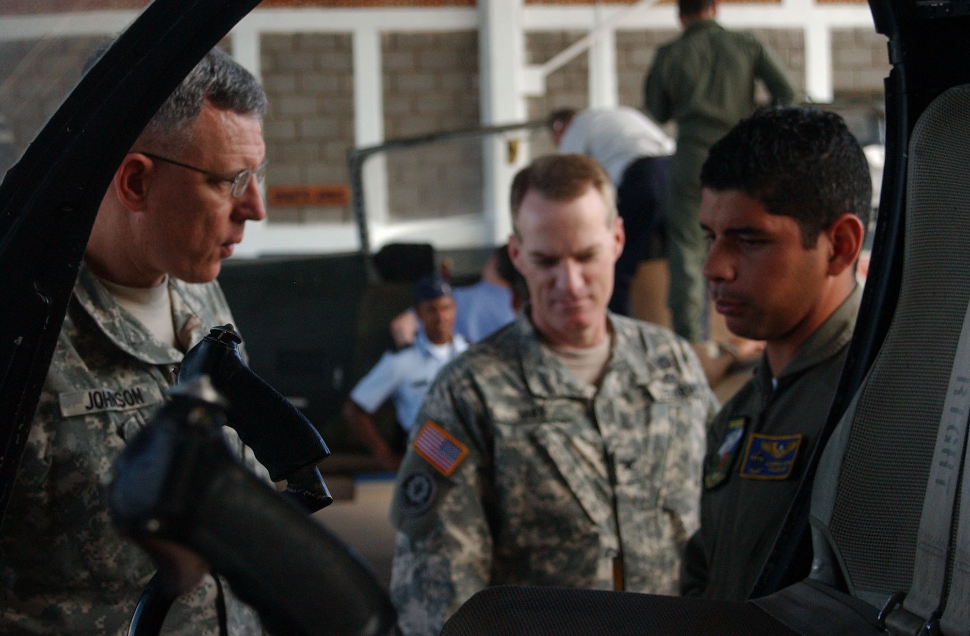 Army Brig. Gen. John Johnson, a Capstone participant, is given an overview of the Honduran air force Academy's aircraft by Honduran 2nd Lt. Rolando Rzunga Bode, during a visit to Soto Cano Air Base, Honduras. Capstone participants traveled throughout the U.S. Southern Command's Area of Responsbility. At each stop, particpants met with U.S. Ebassy members as well as foreign political and military leadership. U.S. Air Force photo by Senior Airman Shaun Emery.        