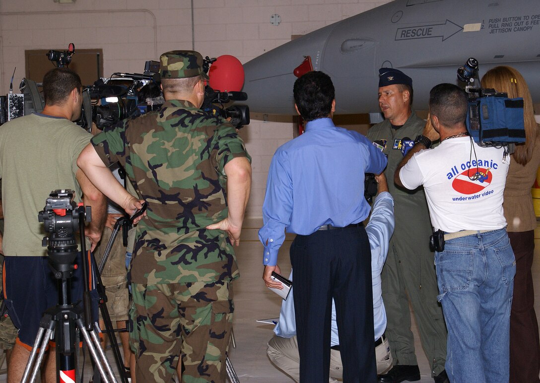 Col. Randy Falcon, 482nd Fighter Wing commander, interviews with local media representatives prior to the arrival of more than 260 reservists from a deployment to Balad Air Base, Iraq. The 93rd Fighter Squadron from the 482nd Fighter Wing at Homestead Air Reserve Base provided close air support and surveillance and reconnaissance missions in support of U.S. and Coalition ground forces throughout its deployment. (U.S. Air Force photo/Senior Airman Erik Hofmeyer)
