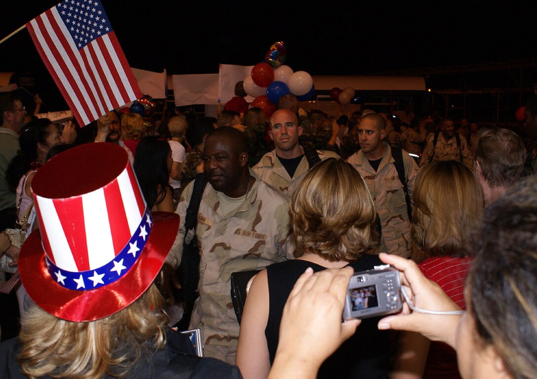 Airmen are greeted with a hero’s welcome as they return from a deployment to Balad Air Base, Iraq on Monday. The 93rd Fighter Squadron from the 482nd Fighter Wing at Homestead Air Reserve Base provided close air support and surveillance and reconnaissance missions in support of U.S. and Coalition ground forces throughout its deployment. (U.S. Air Force photo/Senior Airman Erik Hofmeyer)