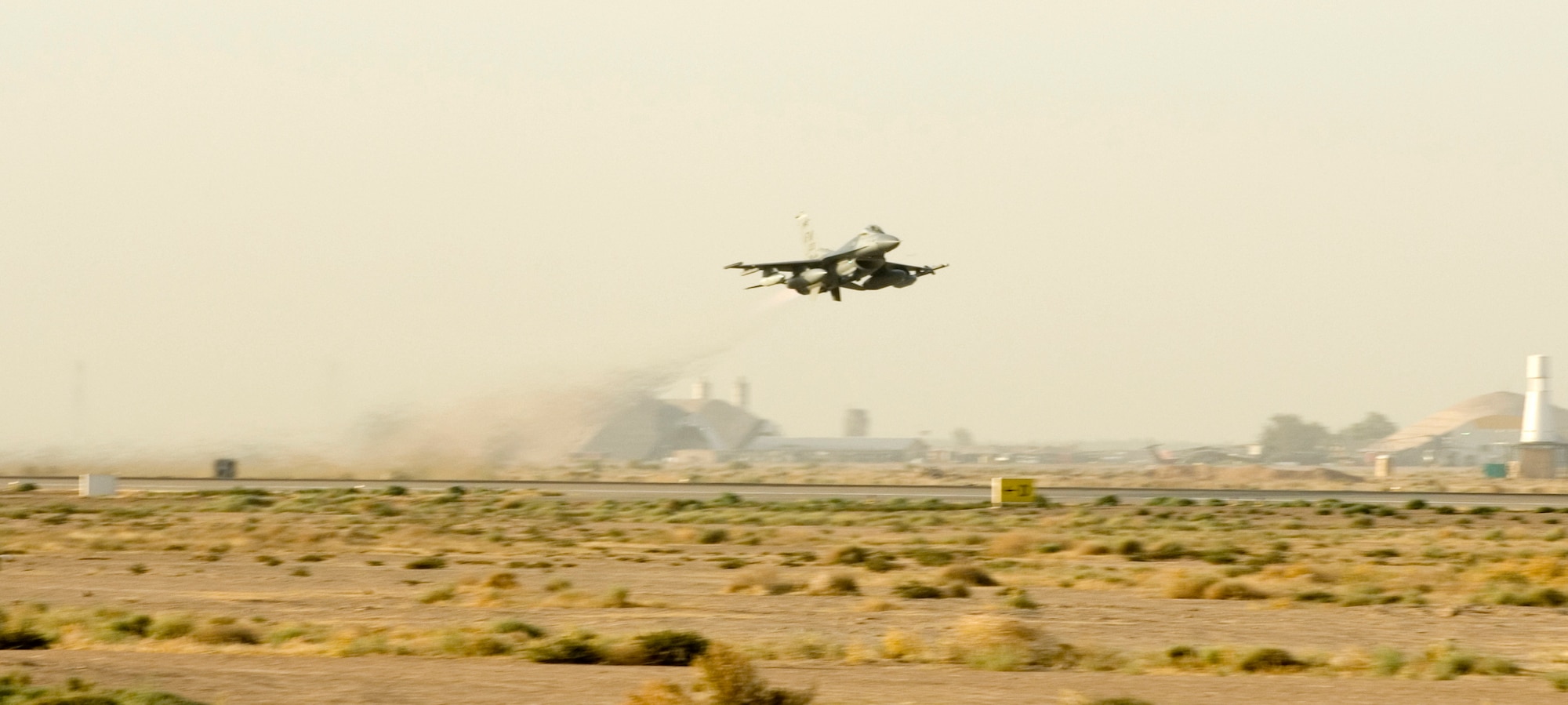 A 93rd Fighter Squadron F-16 departs off from Balad Air Base, Iraq for its return to the 482nd Fighter Wing, Homestead Air Reserve Base Aug. 9. The aircraft was one of 12 482nd FW F-16s and over 260 Airmen deployed in support of Operation Iraqi Freedom. The reservists provided close air support and surveillance and reconnaissance missions in support of U.S. and Coalition ground forces. (U.S. Air Force photo/Tech. Sgt. Alan Port)
