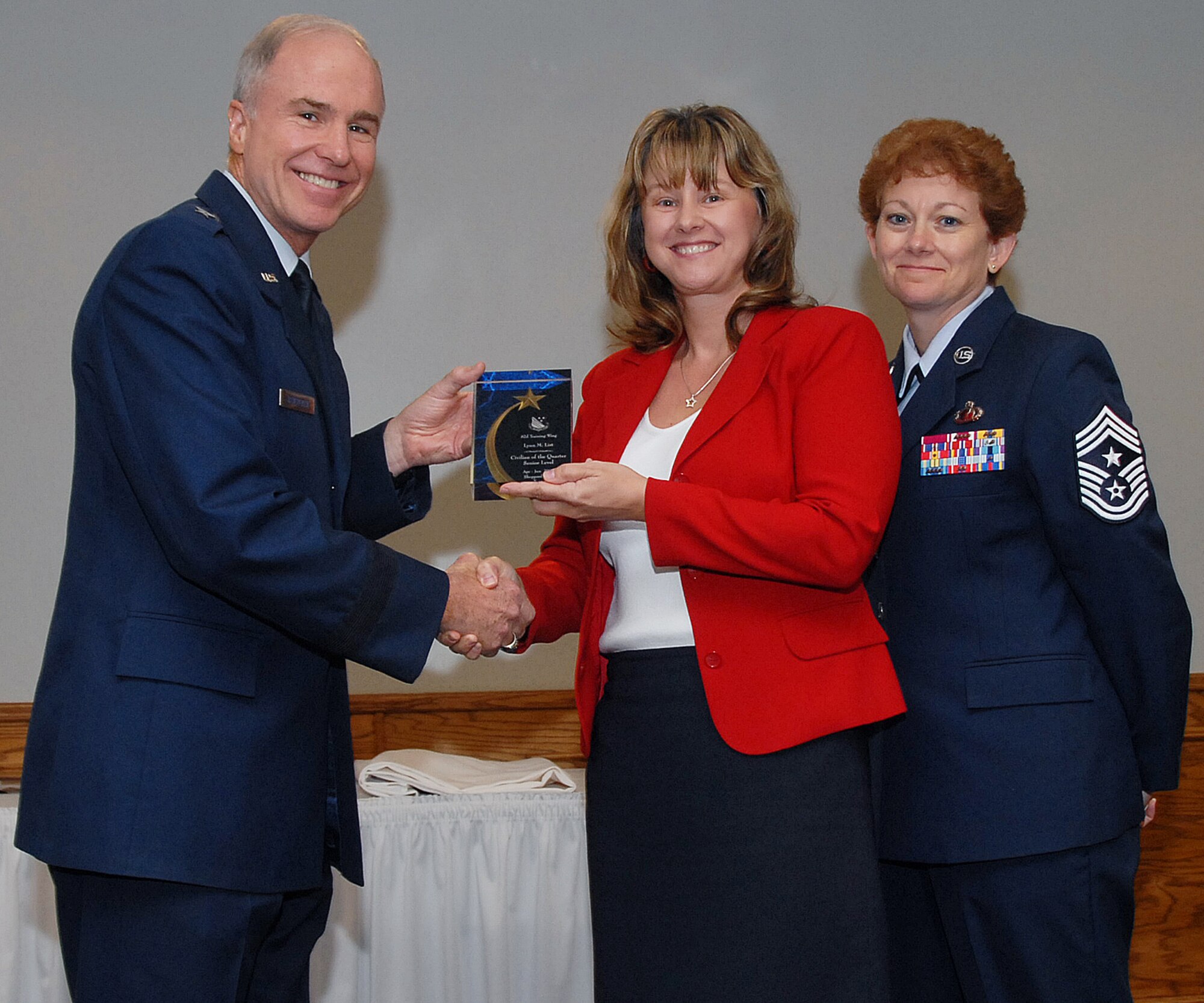 Lynn List, 382nd Training Squadron, won in the senior-level civilian category. Seen here with 82nd Training Wing Commander Brig. Gen. Richard Devereaux and 82nd TRW Command Chief Chief Master Sgt. Jeannie McLean. (U.S. Air Force photo/Mike Litteken)