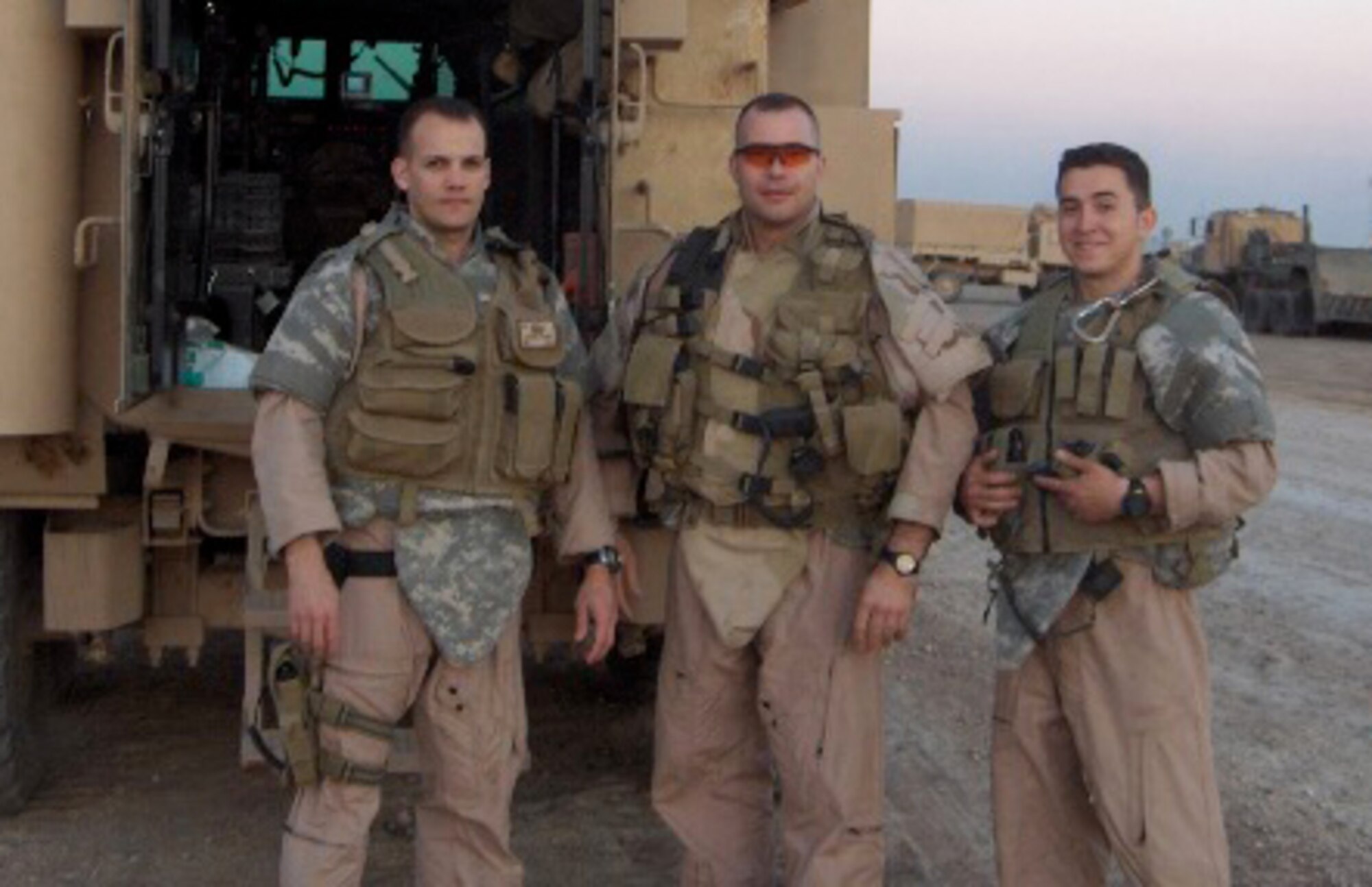 Tech. Sgt. Timothy Haffner (center), 482nd Civil Engineer Squadron explosive ordnance disposal journeyman, stands behind a Joint EOD Rapid Response Vehicle with his EOD team members during his six-month deployment to Iraq. Sergeant Haffner was awarded a Bronze Star for heroism after executing over 140 combat missions and spending over 3,000 hours diffusing improvised explosive devices and unexploded ordnance from roadways, clearing weapon caches and performing post-blast analysis missions. (U.S. Air Force photo)
