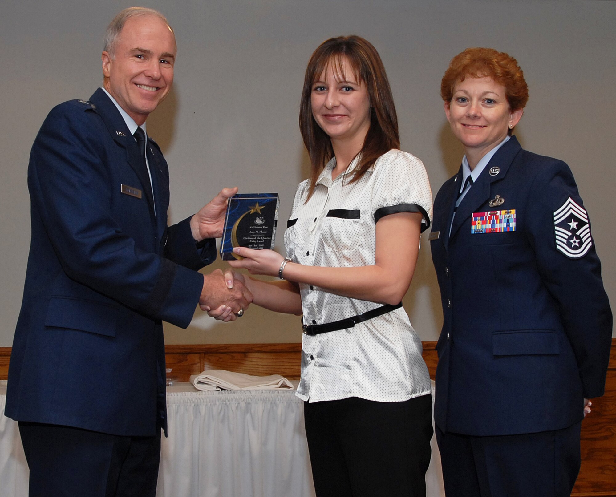 Amy Florez of the 366th Training Squadron won in the entry-level civilian category.  Seen here with 82nd Training Wing Commander Brig. Gen. Richard Devereaux and 82nd TRW Command Chief Chief Master Sgt. Jeannie McLean. (U.S. Air Force photo/Mike Litteken)