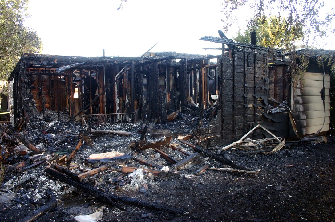 The remains of 103 Childress Street after a fire Aug. 14.  No one was inside the house at the time of the fire, and none of the responders were injured. (U.S. Air Force photo/Staff Sgt. Tonnette Thompson)
