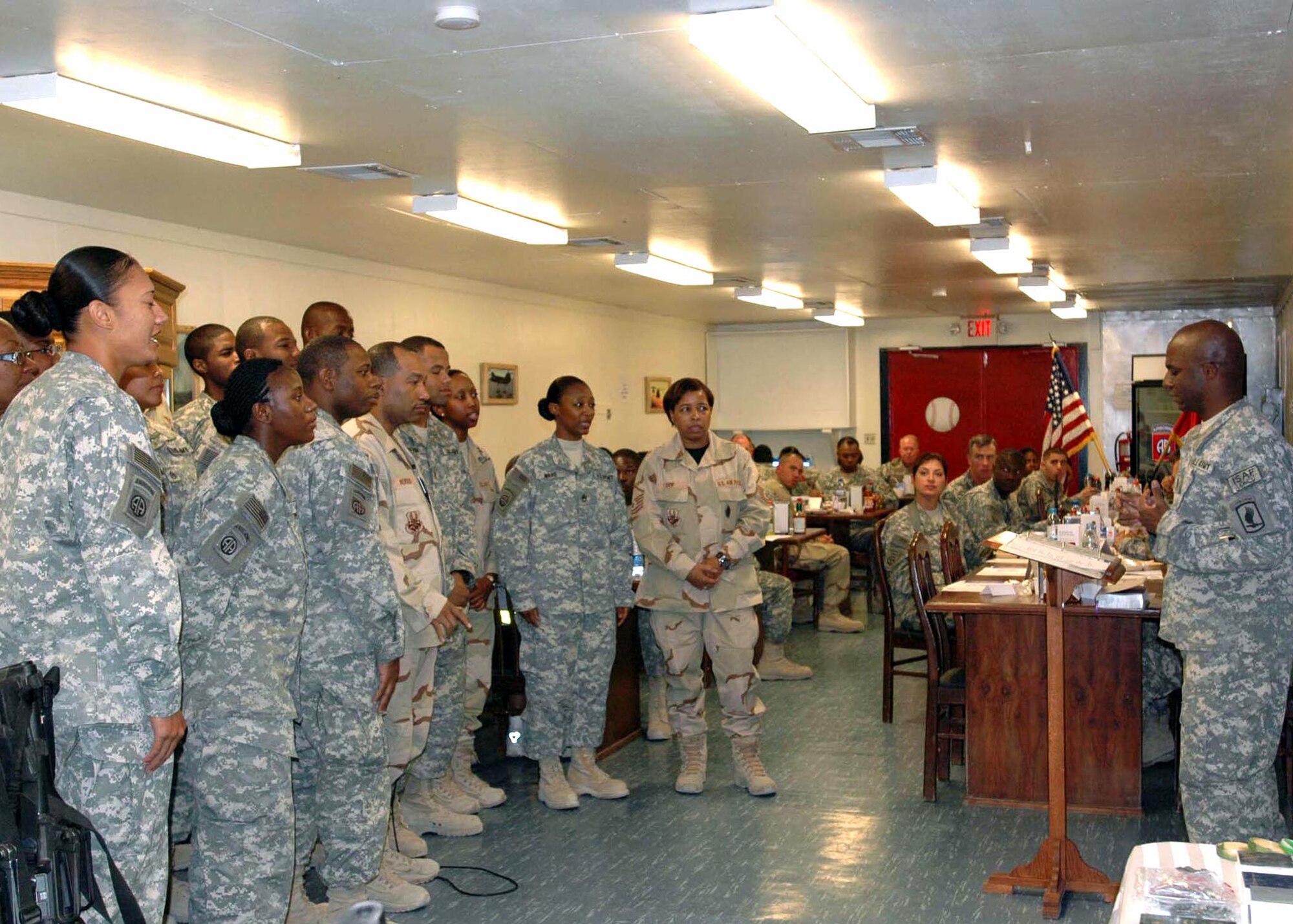 BAGRAM AIRFIELD, Afghanistan -- The Enduring Faith Gospel Choir performs at the Pegasus Prayer Breakfast, hosted by the 82nd Combat Aviation Brigade at the aviation dining facility, Pegasus Inn Forward, Bagram Airfield, Afghanistan. The choir is open to members of all services, with Airmen from the 455th Air Expeditionary Wing participating. (U.S. Army photo by SFC Krishna Gamble)