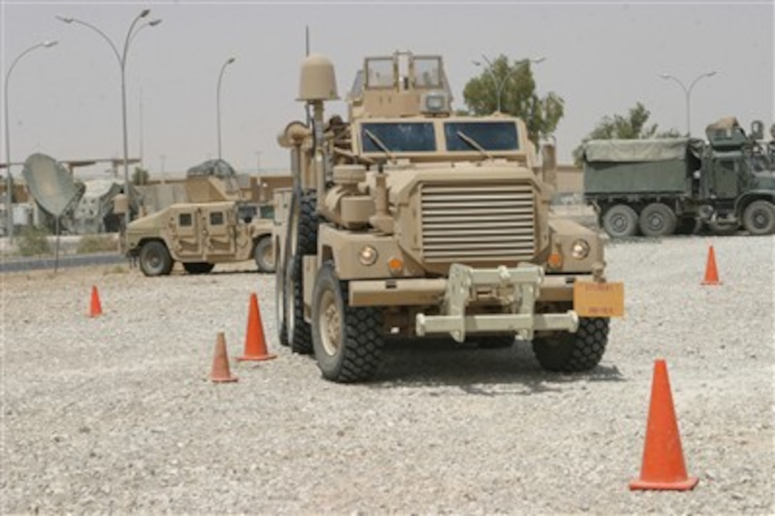 U.S. Marines from Task Force Military Police drive a Mine Resistant Ambush Protected, more commonly known as MRAP, vehicle through a course at the motor pool in Al Asad, Iraq, on July 24, 2007.  The Marines are learning to maneuver the vehicle through different road courses to obtain their MRAP license.  
