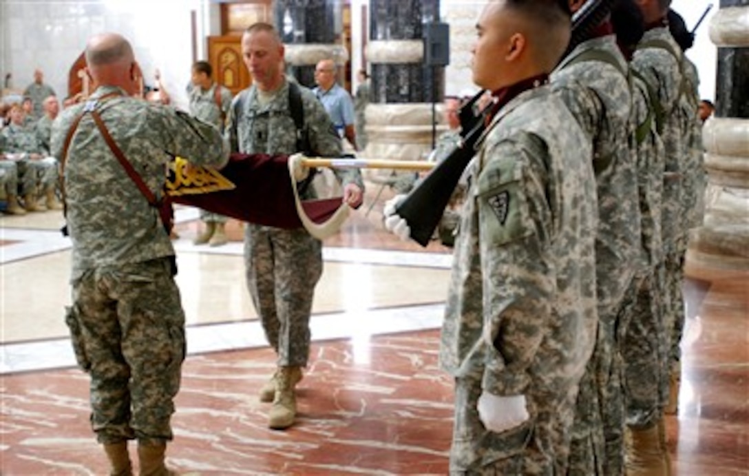 Army Maj. Gen. Ronald D. Silverman (left), commander, 3rd Medical Command, and Command Sgt. Maj. Roger Schulz case their unit colors during a transfer of authority ceremony Aug. 15, 2007, at Camp Victory's Al Faw Palace in Baghdad. The ceremony marked the end of a yearlong deployment for the 3rd Medical Command.