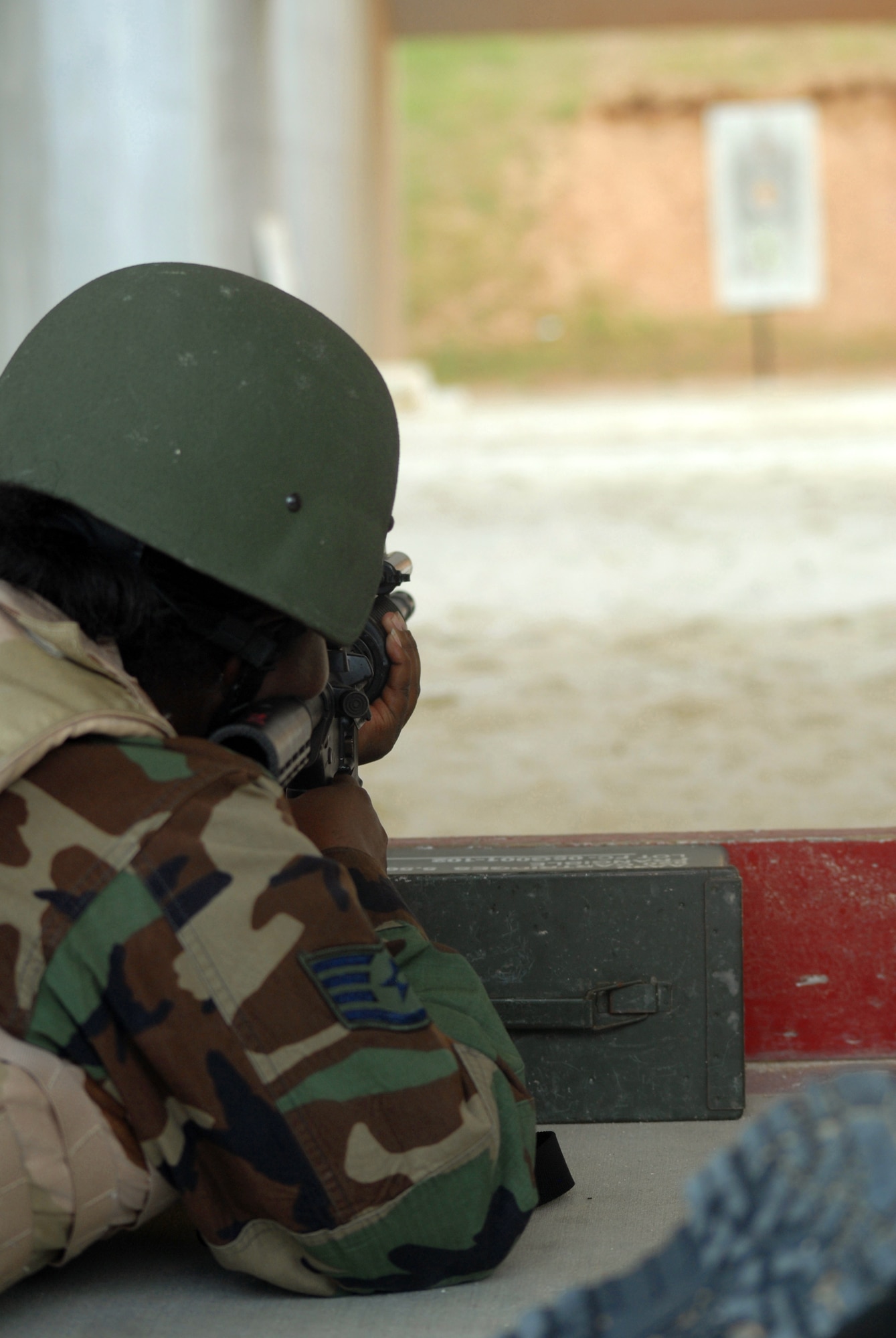 Staff Sgt. Shanika Lane fires upon her target during the M4 Tactical Qualification Course at Kadena Air Base, Japan, Aug. 7, 2007. The course ensures that every security forces member stay qualified with the M4 rifle. Sergeant Lane is assigned to the 18th Security Forces Squadron.  (U.S. Air Force photo/Senior Airman Darnell T. Cannady)