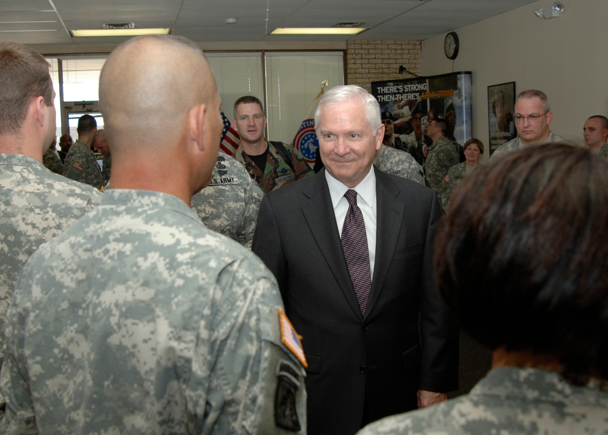 MCCONNELL AIR FORCE BASE, Kan. -- Secretary of Defense Dr. Robert M. Gates speaks with local U.S. Army recruiters during a visit to the U.S. Army recruiting center in Wichita, Aug 9. Secretary Gates, a native to Kansas, visited the recruiting center as part of a recent visit to the area. (photo by Airman 1st Class Roy Lynch)