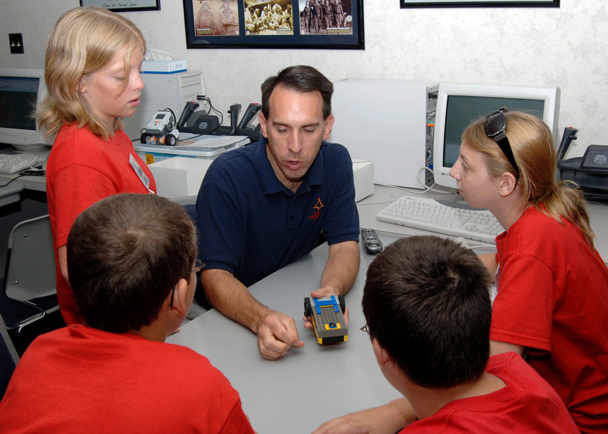 Kansas Starbase instructor Doug Frahm teaches students in the Kansas Starbase summer program on the programmable RCX Lego robot Aug 8. The Kansas Starbase goal is to improve students in the fourth, fifth and sixth grades interest in the areas of math, science and technology as well as instilling a sense of pride and personal accomplishment.  The Air Force National Guard runs the Wichita area Kansas Starbase program with several different classes held throughout the school year and summer. (photo by Airman 1st Class Roy Lynch) 