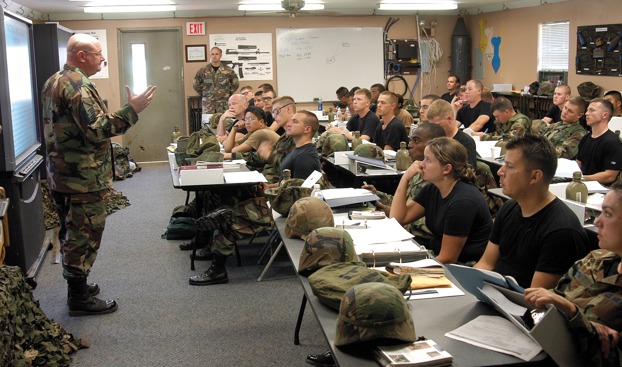 Master Sgt. Larry Shenold, Combat Readiness School's chief of academics, teaches how to handle prisoners, focusing students on what to expect in areas like Iraq and Afghanistan. The 40 students are enlisted and officers and come  from various bases but share the common future of an upcoming deployment. Training in land navigation, self-aid/buddy care and field fortifications are part of the first week.  By week three, Airmen are living and defending positions, learning to survive under sleep-deprived, harsh conditions.  (Air Force photo by Margo Wright)

