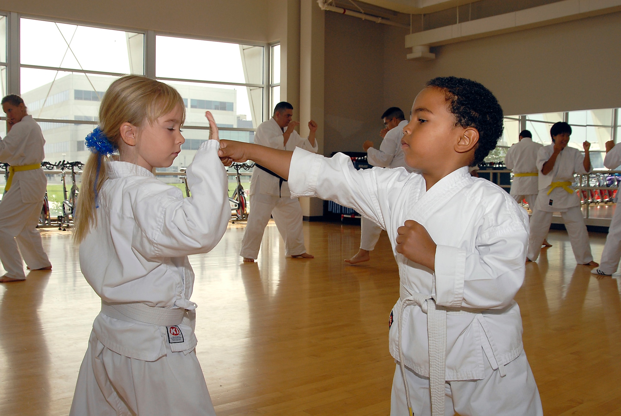 Quentin Evans, 4, and Avianna Raupach, 6, demonstrate their striking technique.  Martial Arts students and fans gathered at the Los Angeles AFB Fitness Center for a demo of the Cory Jitsu / Comba-tai discipline, Aug. 11.  (Photo by Joe Juarez)