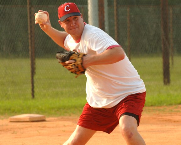 Eric Hale, 437th Airlift Wing, throws the ball to the first baseman during his team's final practice before the Air Force-wide tournament. (U.S. Air Force Photo/Staff Sgt. April Quintanilla)