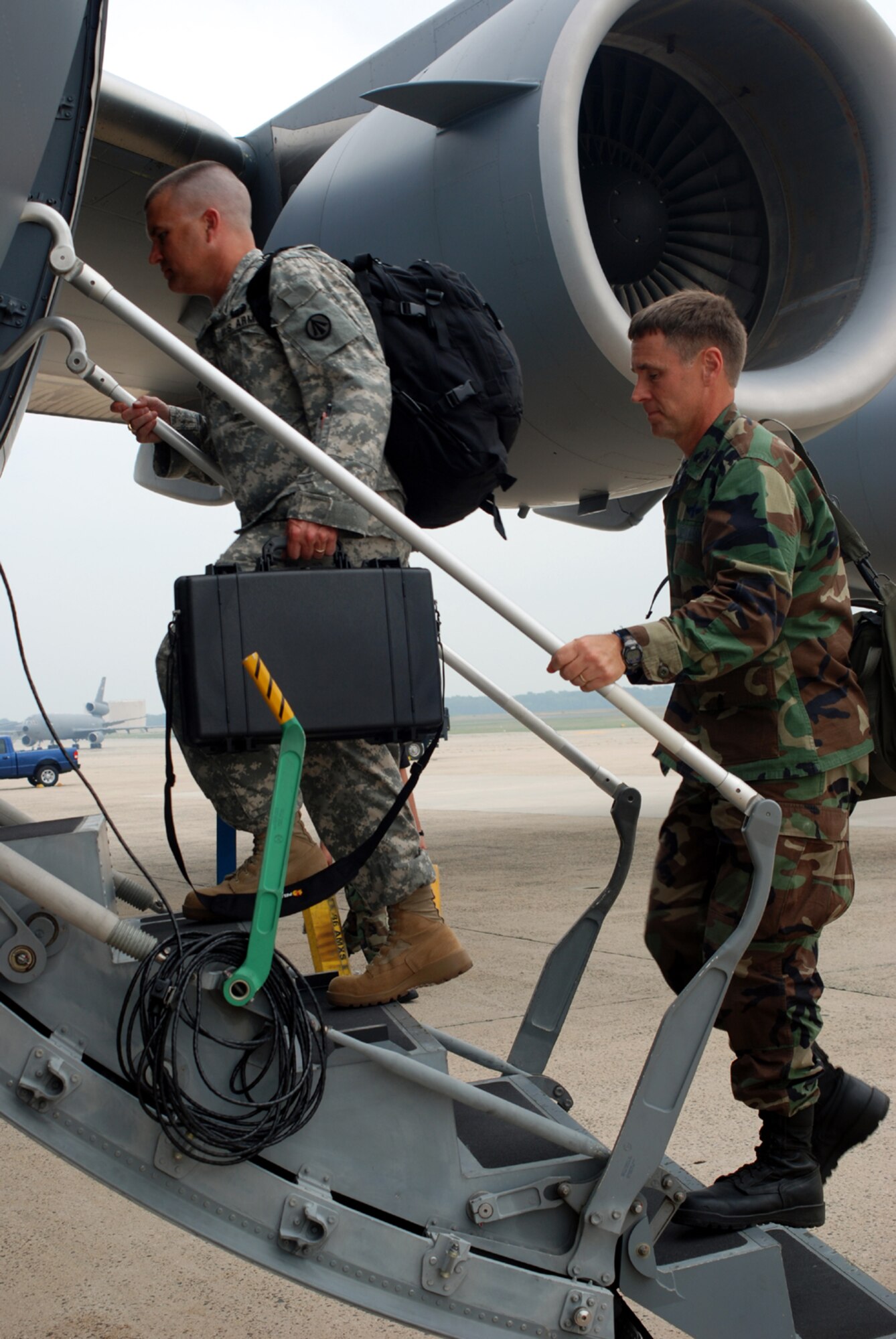 Joint Assessment Team members board their aircraft as they prepare to deploy to Puerto Rico in response to "Hurricane Dean" Aug. 16 here. The 16-member team will assess the area and decide how many personnel and assests are needed in the field.