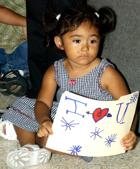 Raven Gadsby, 3-years-old, sits on the floor of the Los Angeles Airport Sat., August 11, waiting for her father Staff Sgt. Ricardo Gadsby to return home. Sergeant Gadsby was on of six team members from the 452nd Security Forces Squadron at March Air Reserve Base to return from a six month deployment to Kirkuk, Iraq.                               