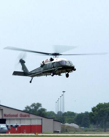 The Marine One helicopter carrying President George Bush flies by the hangars of the 133rd Airlift Wing, Minnesota Air National Guard in Minnesota Aug. 4. President Bush is visiting the scene of the interstate 35W bridge collapse in downtown Minneapolis. (U.S. Air Force photo by Tech. Sgt. Erik Gudmundson) 
