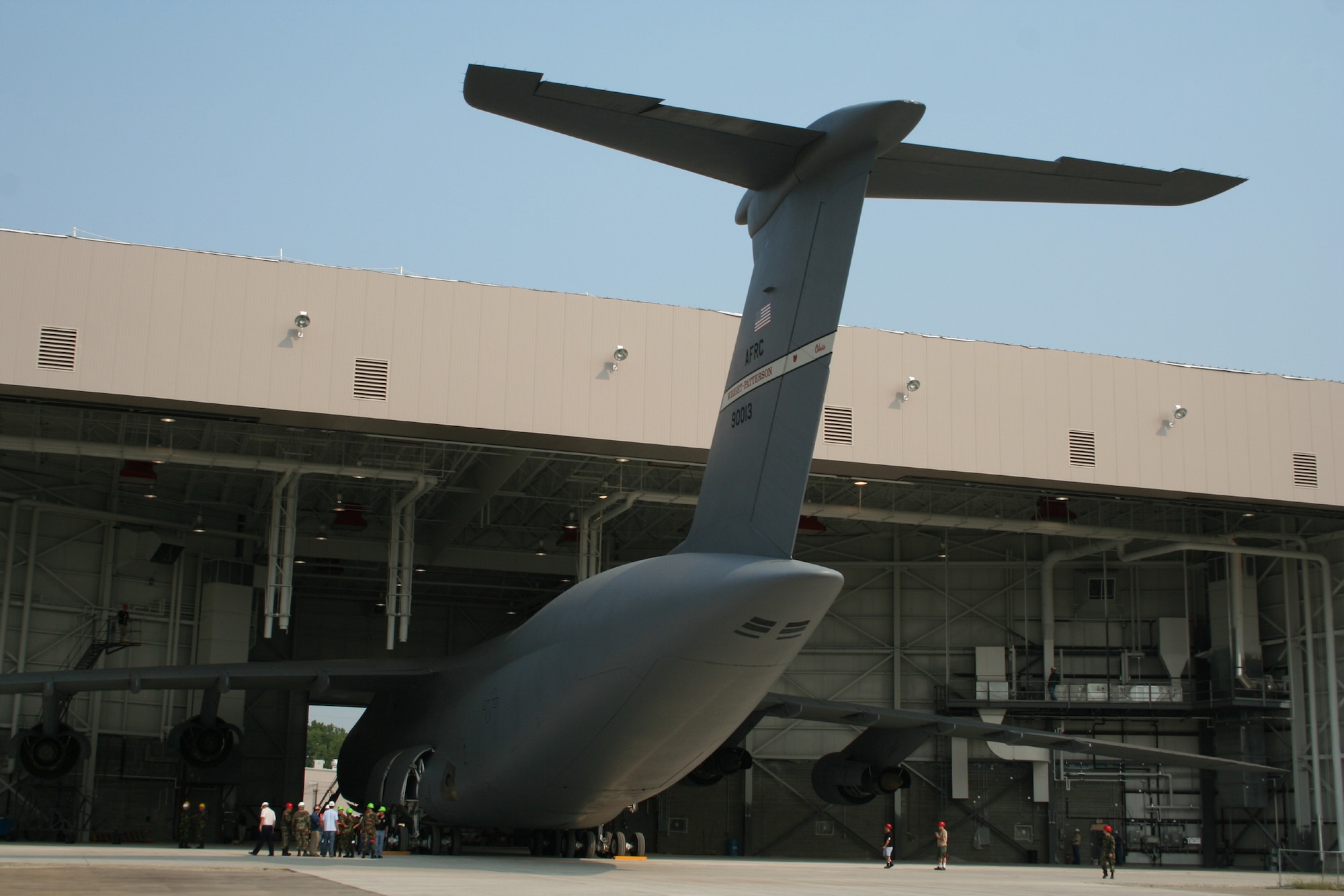 WRIGHT-PATTERSON AFB, Ohio - The 445th Airlift Wing conducts a fit test for the C-5 Galaxy to ensure the aircraft fits inside the new Fuel System Maintenance Hangar appropriately August 15, 2007. The hangar is a tail-out, high bay fuel cell maintenance hangar.  It includes two 14 foot tall adjacent spaces for auxiliary functions, which include administrative and supervisory functions, a tool room, and space to house mechanical, electrical, and fire protection equipment. (U.S. Air Force photo/Laura Darden)