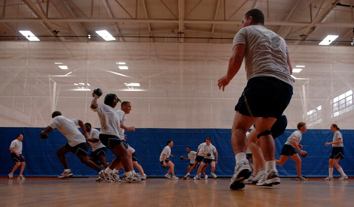 Senior NCOs from the Senior NCO Enhancement Seminar and Airmen from the First Term Airmen Center play dodge ball Wednesday at the Fitness and Sports Center. Though the senior NCO inductees won two of the matches, the FTAC Airmen won five of the matches. The induction ceremony for the Senior NCOs was held Thursday at the Charleston Club. (U.S. Air Force photo/Airman 1st Class Nicholas Pilch) 