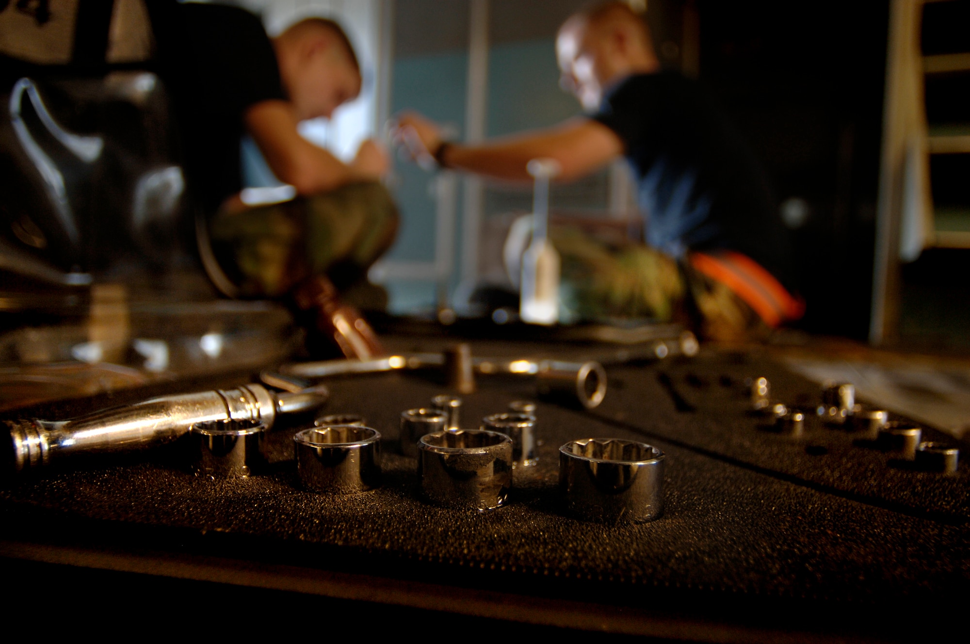 Airmen inspect a C-17 during the home station check in a hangar on Charleston AFB Aug. 9. Charleston Airmen participated in a lean event here recently in an effort to eliminate waste and save time during the HSC process. (U.S. Air Force Photo/Airman 1st Class Nicholas Pilch)