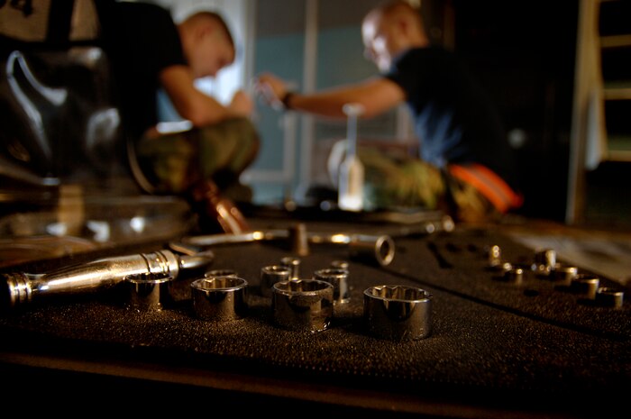 Airmen inspect a C-17 during the home station check in a hangar on Charleston AFB Aug. 9. Charleston Airmen participated in a lean event here recently in an effort to eliminate waste and save time during the HSC process. (U.S. Air Force Photo/Airman 1st Class Nicholas Pilch)