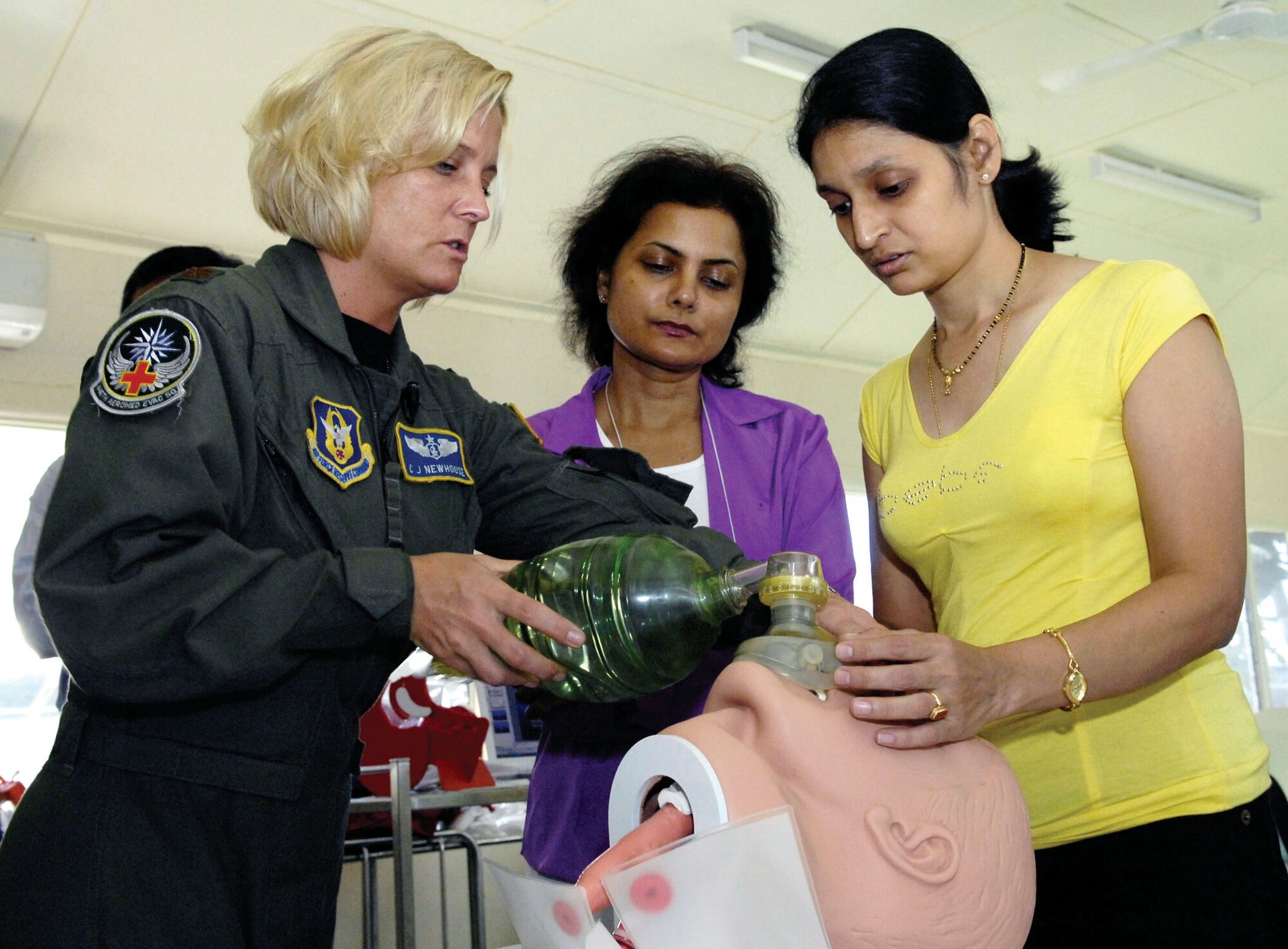 Maj. C.J. Newhouse conducts emergency airway training for Dr. Jyoti Dubey and Dr. Deepti Datey July 21 in the Republic of Nauru. Major Newhouse, an Air Force Reserve flight nurse with the 446th Aeromedical Evacuation Squadron at McChord Air Force Base, Wash., was part of a 12-person, joint-force Pacific Command medical team visiting the Pacific Island July 21 through 28. (U.S. Air Force photo/Tech. Sgt. Chris Vadnais)
